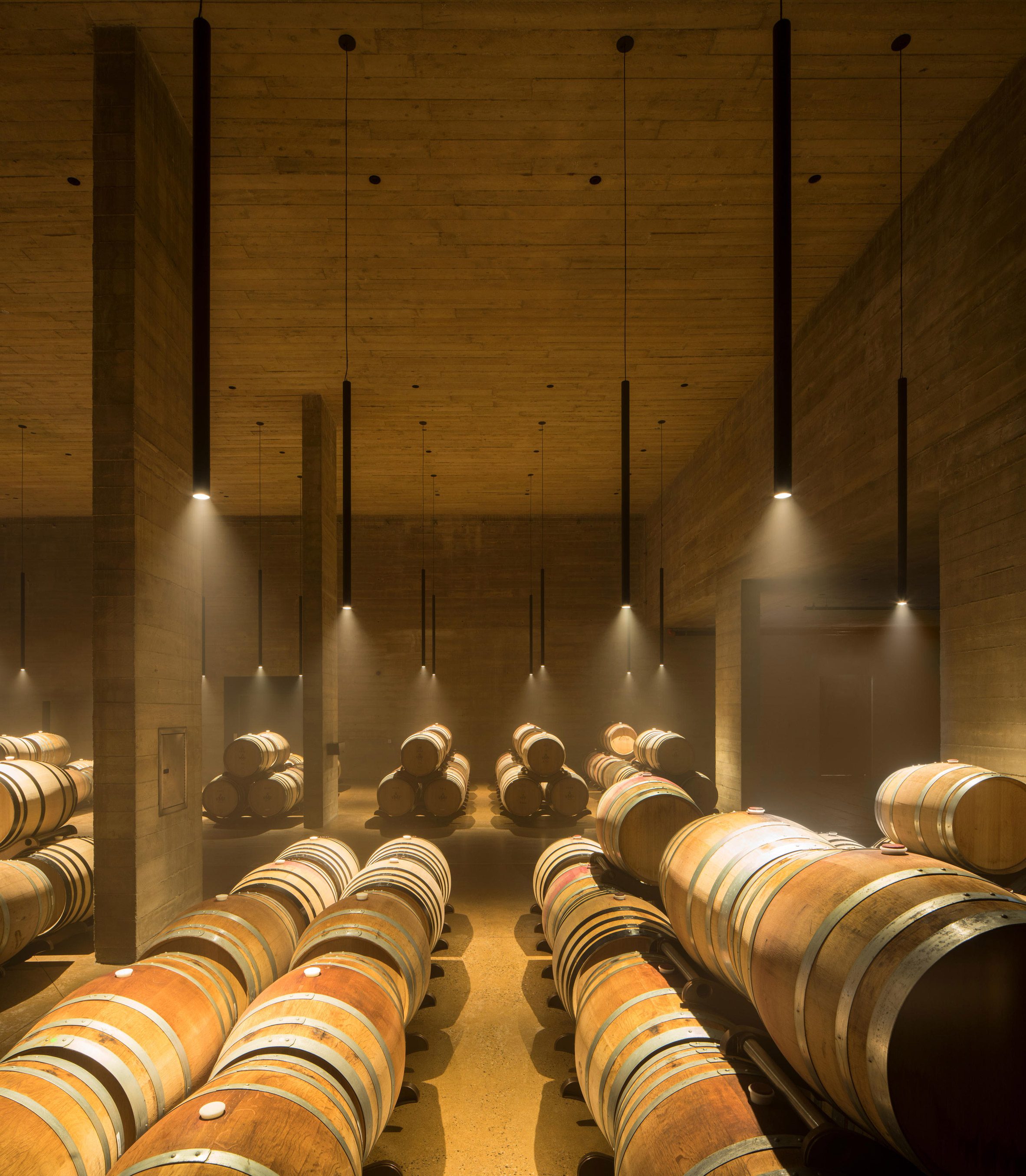 Olson Kundig embeds gravity-flow winery into British Columbia hillside-8