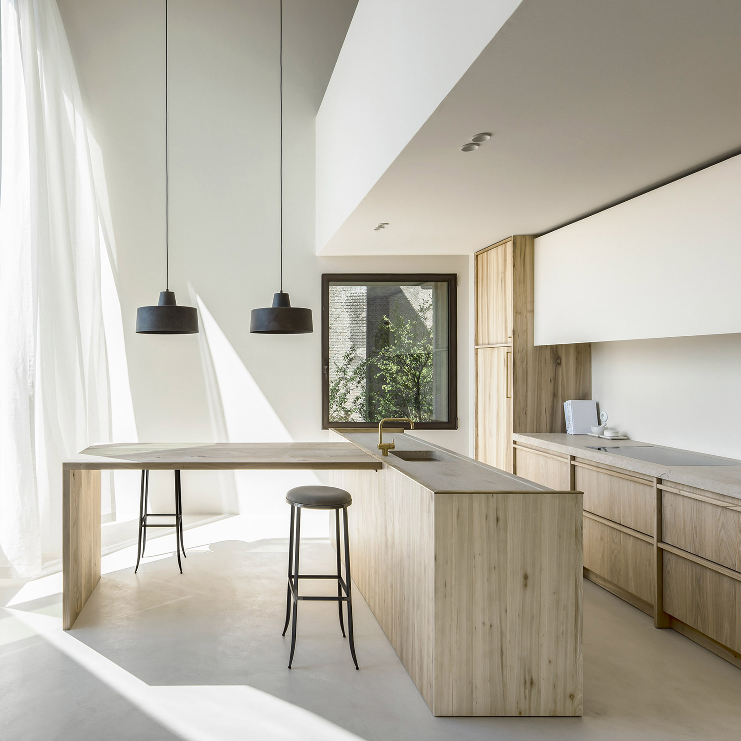 Arjaan De Feyter combines "light and warm materials" in converted brewery apartment-0
