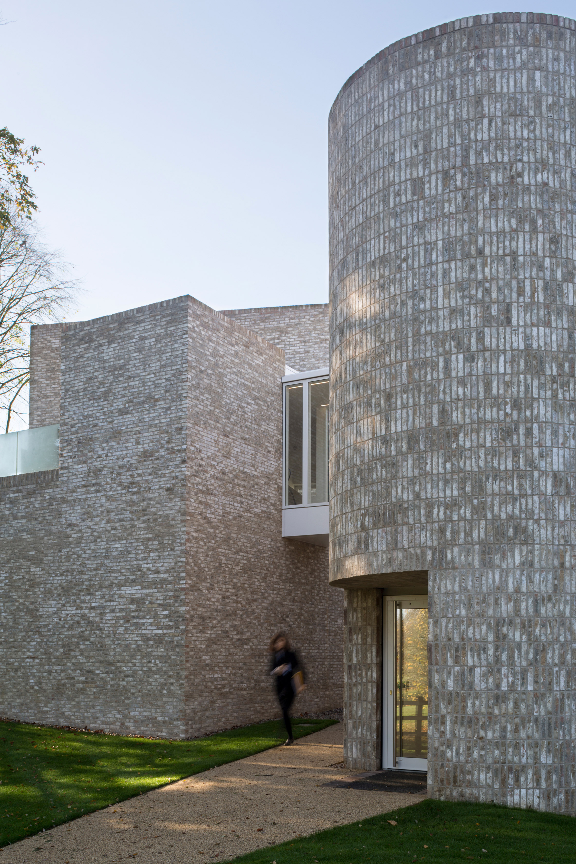 Geometric brick-clad boarding house by MICA references its neighbours-18