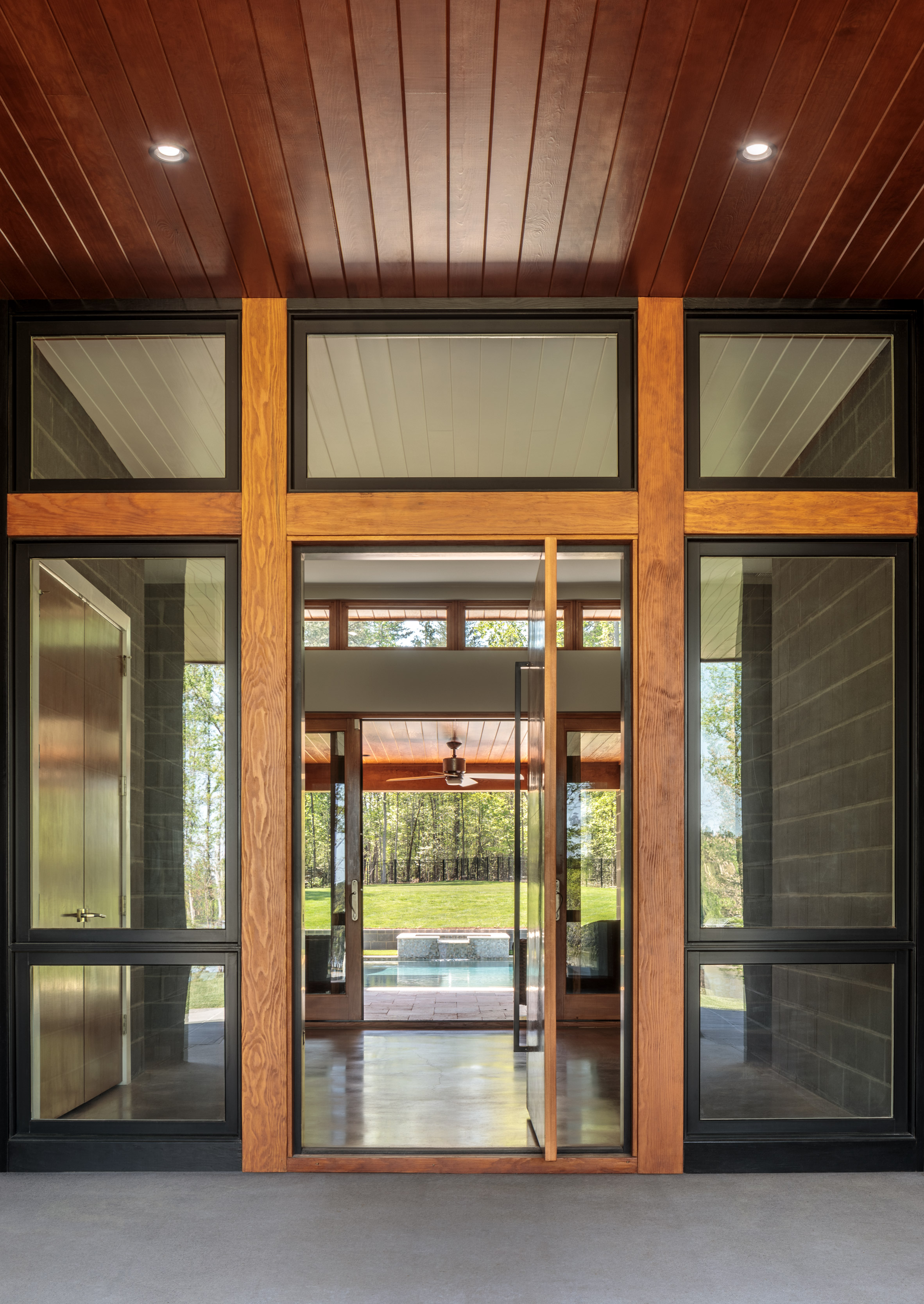 Grey stone, stucco and warm timber wrap South Carolina home by Marica McKeel-15