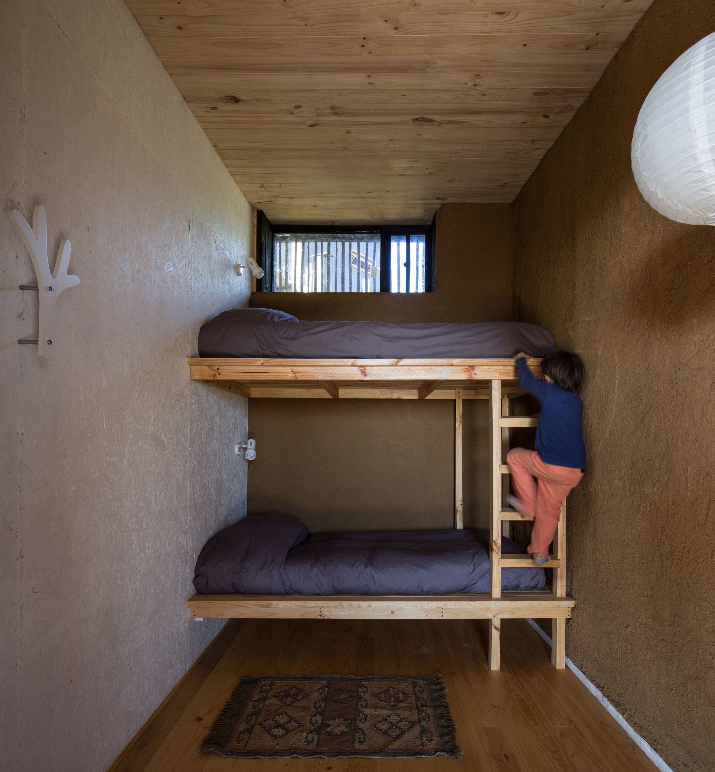 Studio Selva wraps Chilean surfers' retreat in eucalyptus screens-11