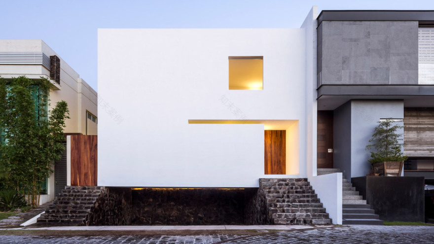 Abraham Cota Paredes' inward-looking Cave House features huge window to tree-planted atrium-0