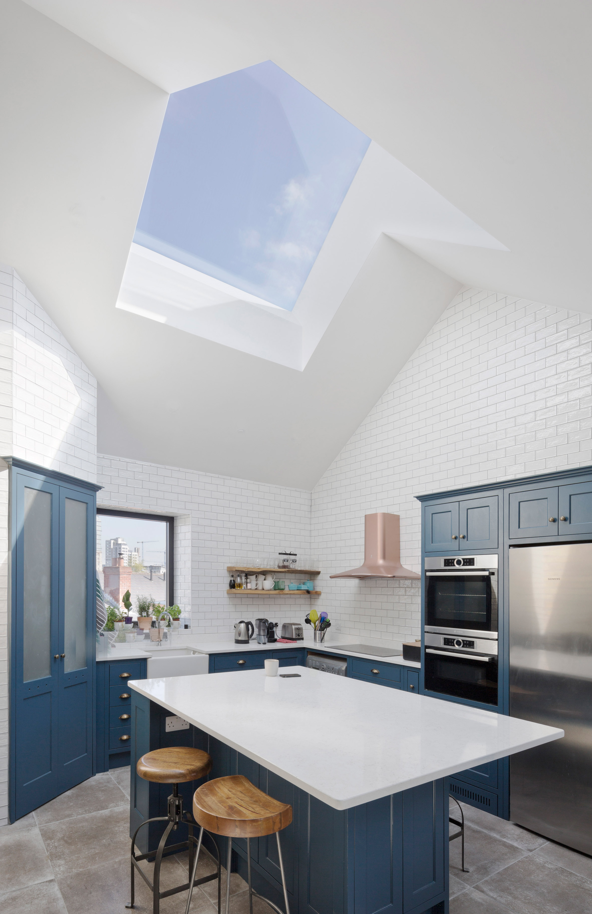 Scullion Architects adds charred-larch tower to terraced home in Dublin-5