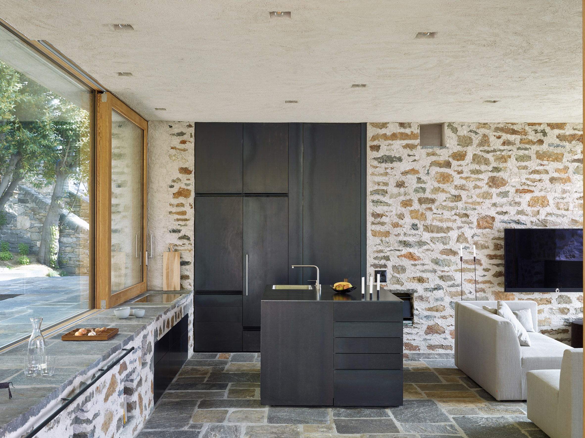 Wespi de Meuron Romeo uses stone and plaster for lakeside house-19