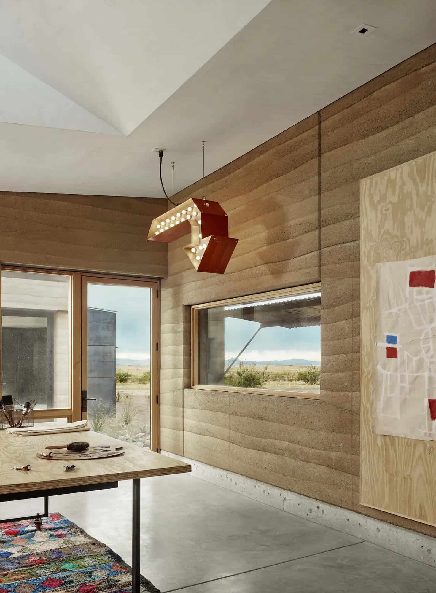 See this remarkable rammed earth house nestled on a Texas ranch-25