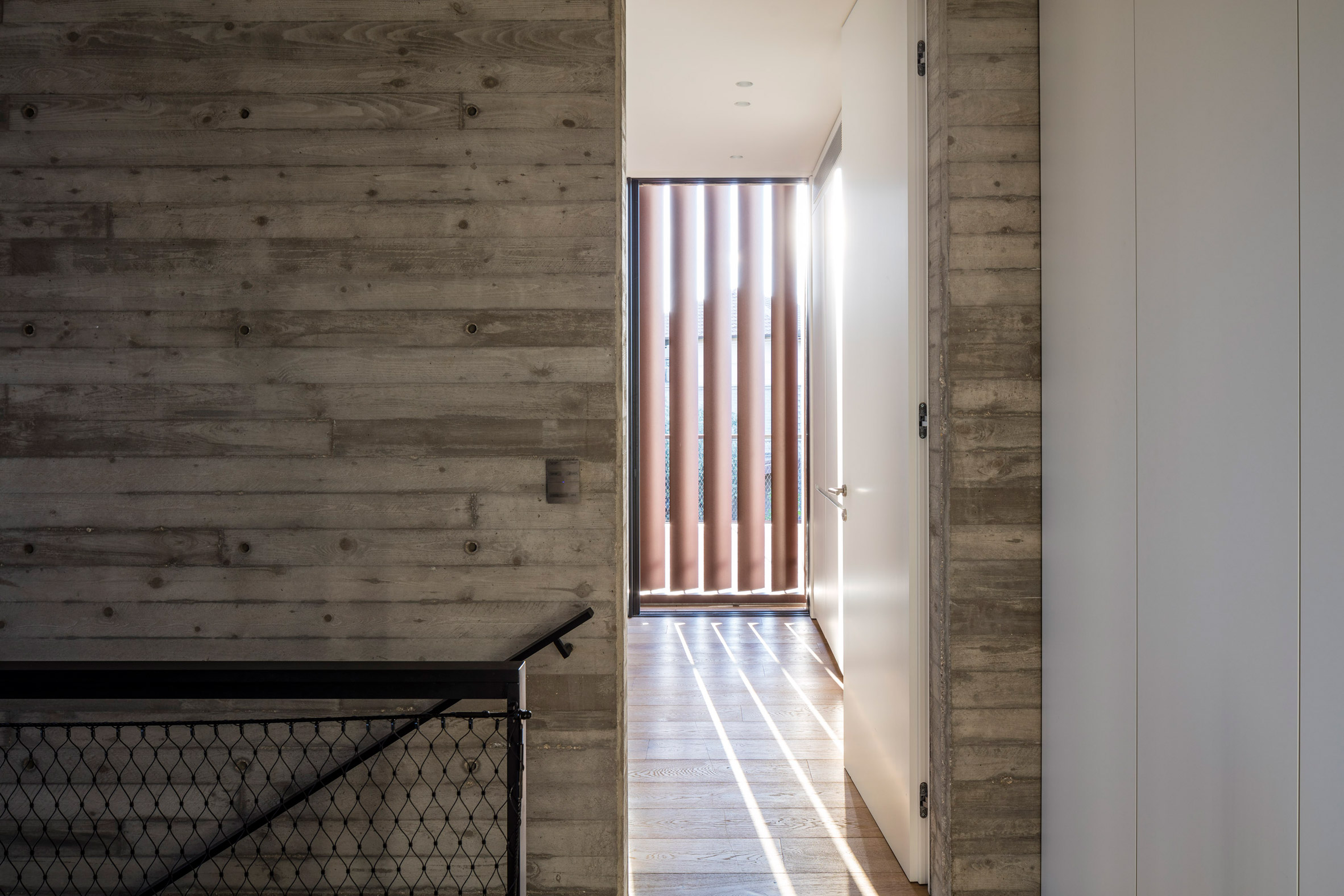 Box-framed louvres shade board-marked concrete Tel Aviv house-31