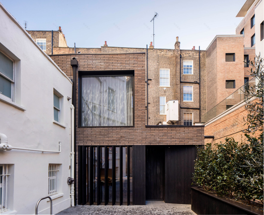 Pivoting louvres conceal windows of mews house by Belsize Architects-5