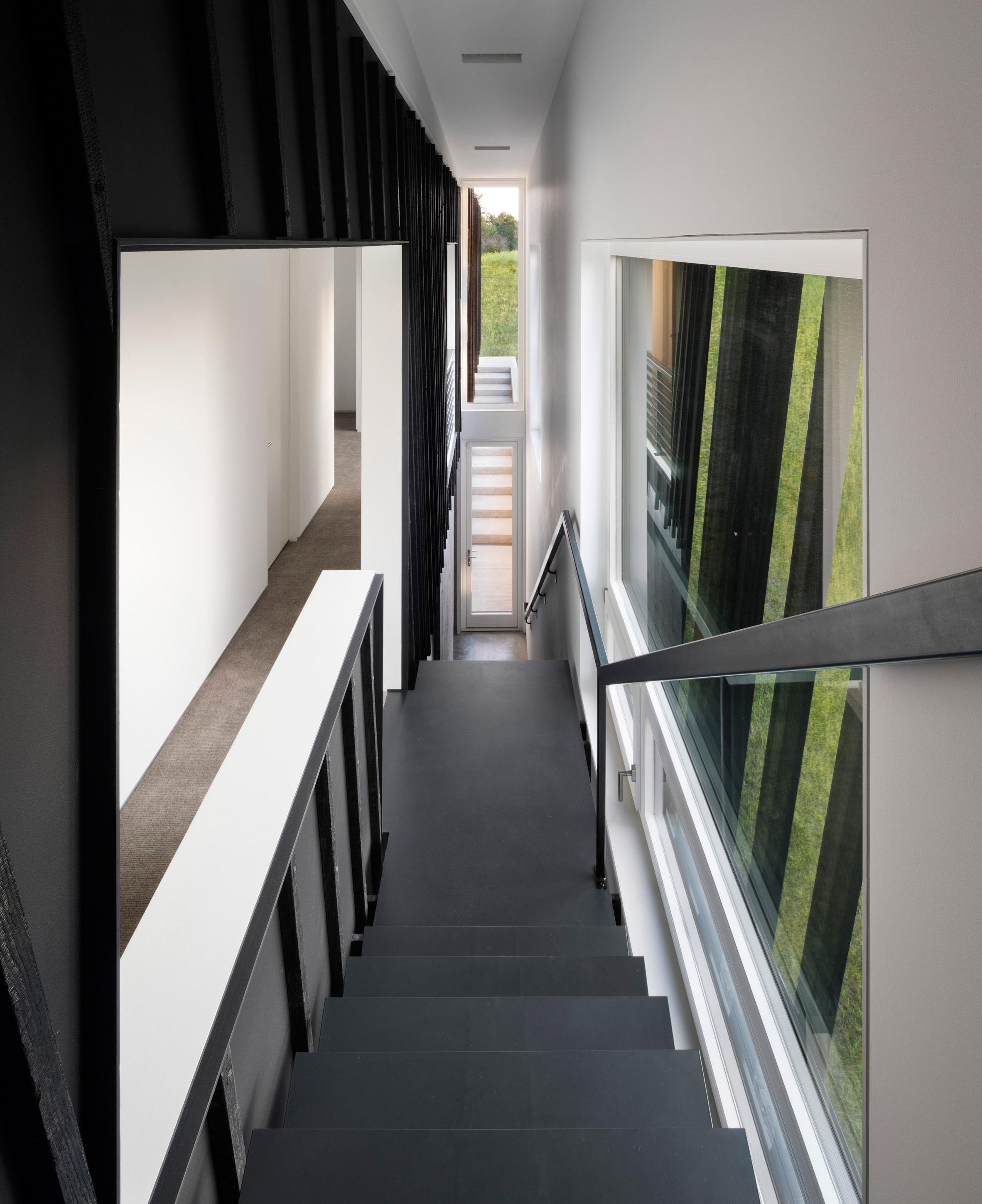 A/O builds slanted black holiday home in Hudson Valley-16