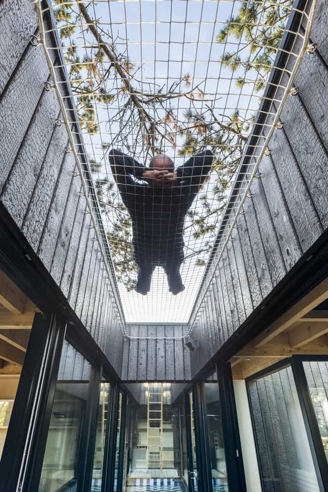 Uniquely Treehouse inspired house by Atelier Victoria Migliore features stilts, swings, and climbing nets just like the real thing-10