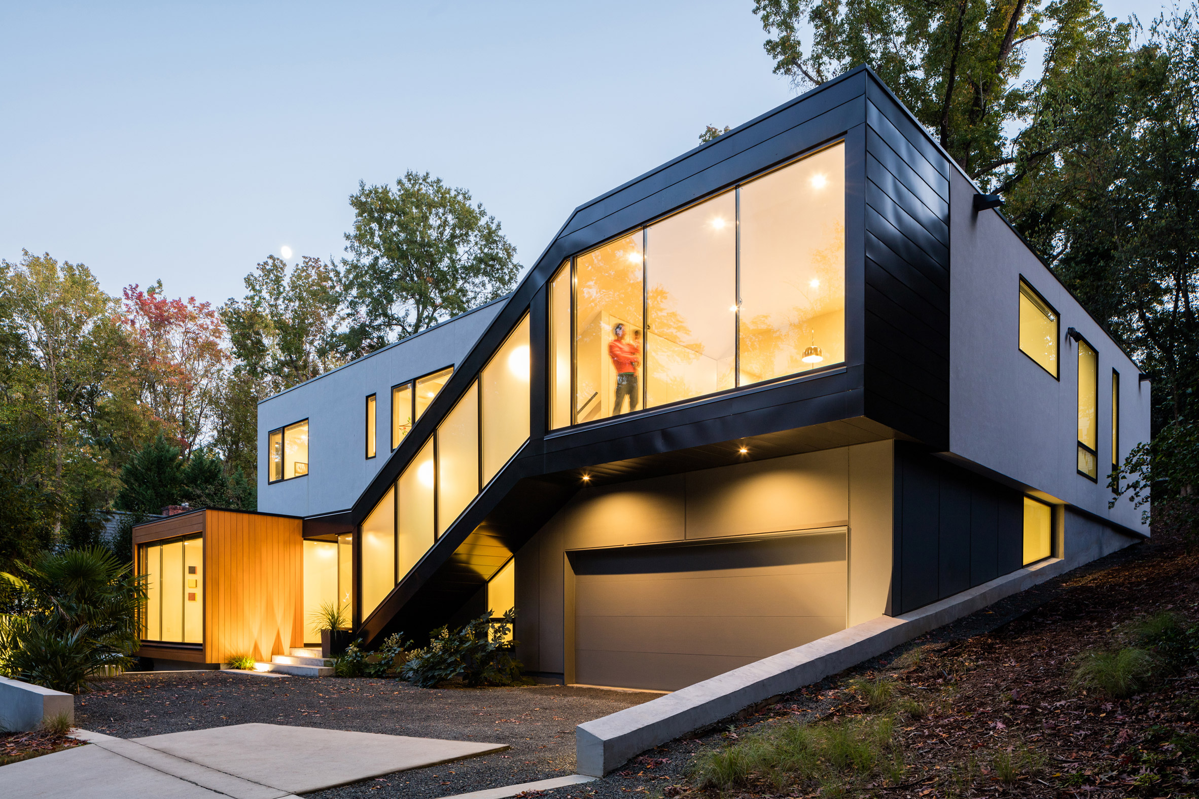 Black stairwell cuts across front of North Carolina home-24