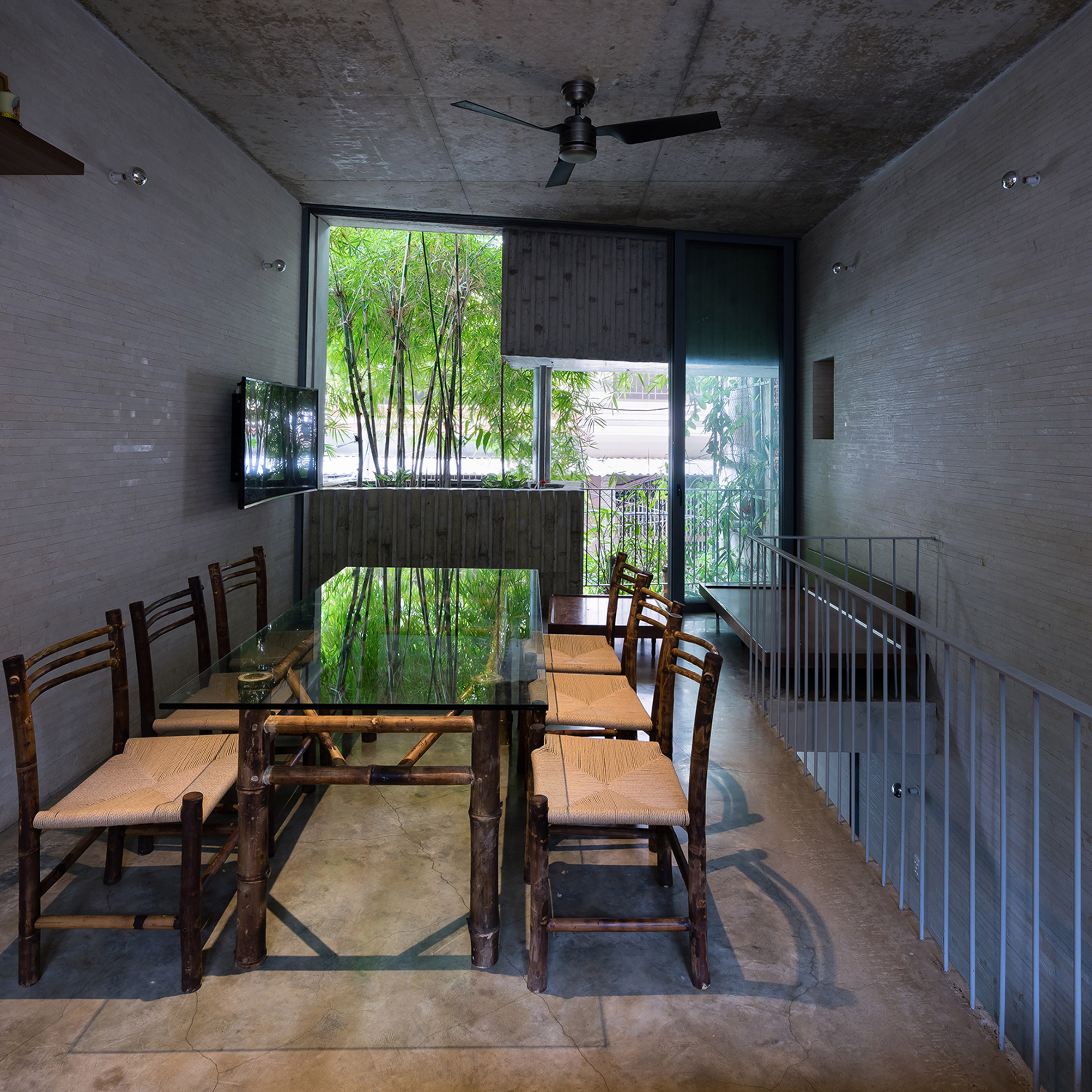 Vo Trong Nghia fronts narrow house in Vietnam with huge bamboo plant boxes-17