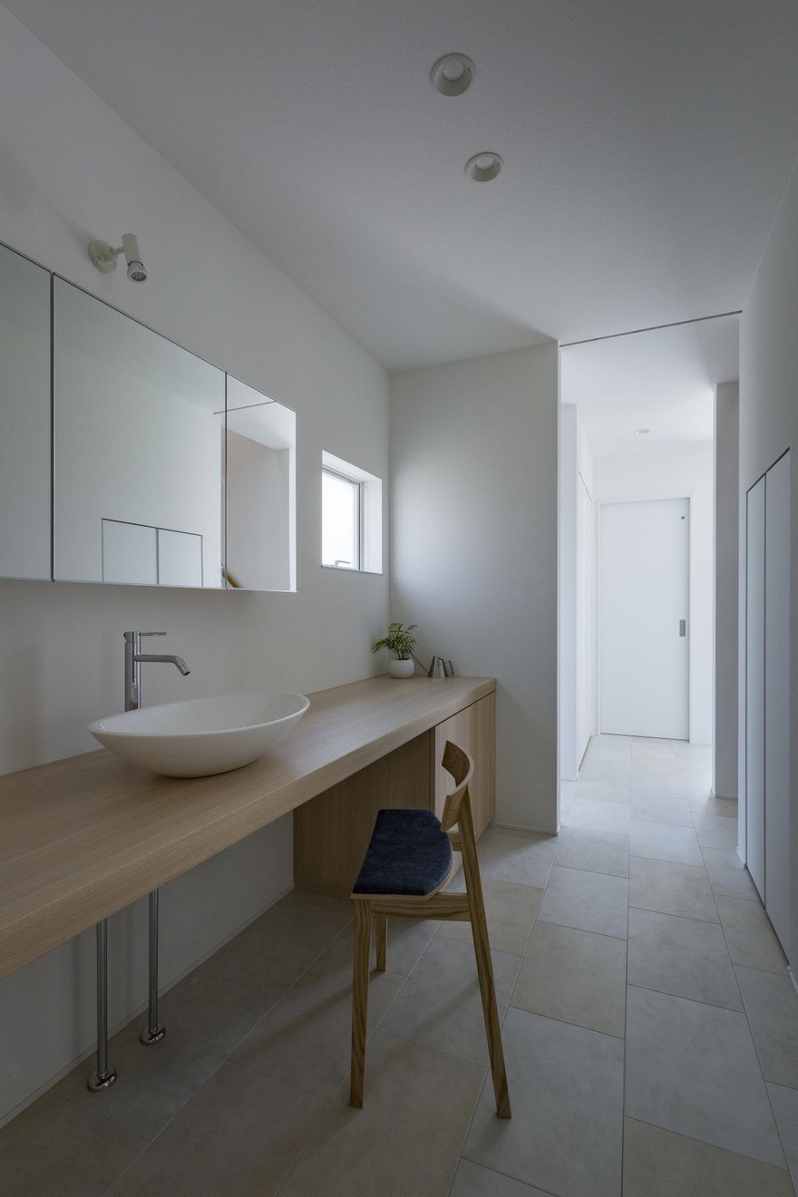 Box-Shaped Japanese Home with Warm Minimalist Interior Design-17