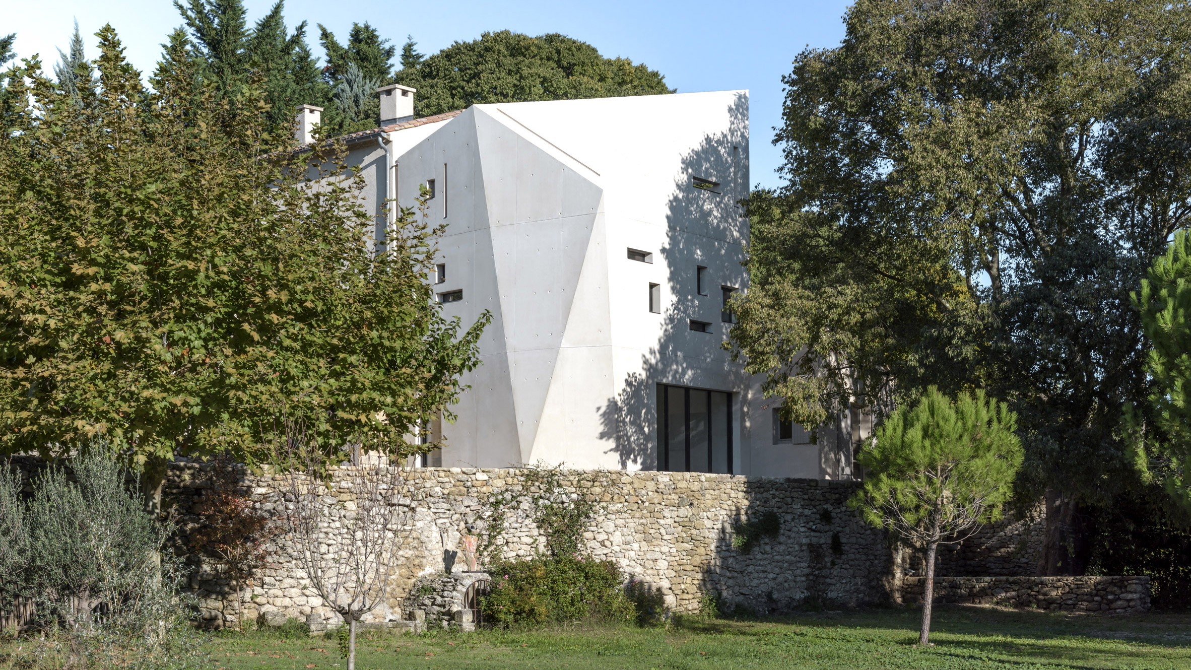 Sculptural extension to French farmhouse protects interiors from harsh summer sun-0