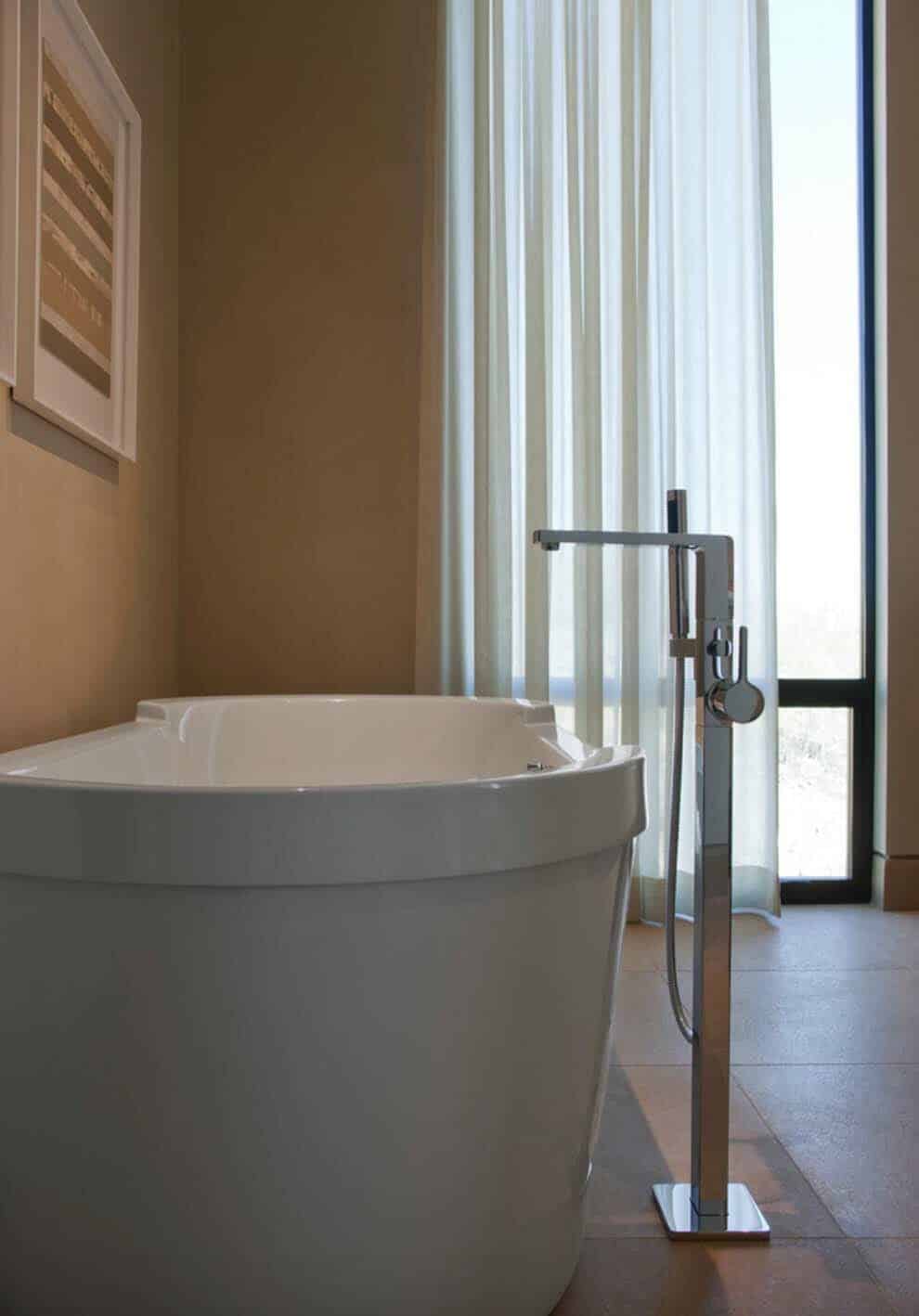 Modern desert home set on a rocky hillside with spectacular city views-23