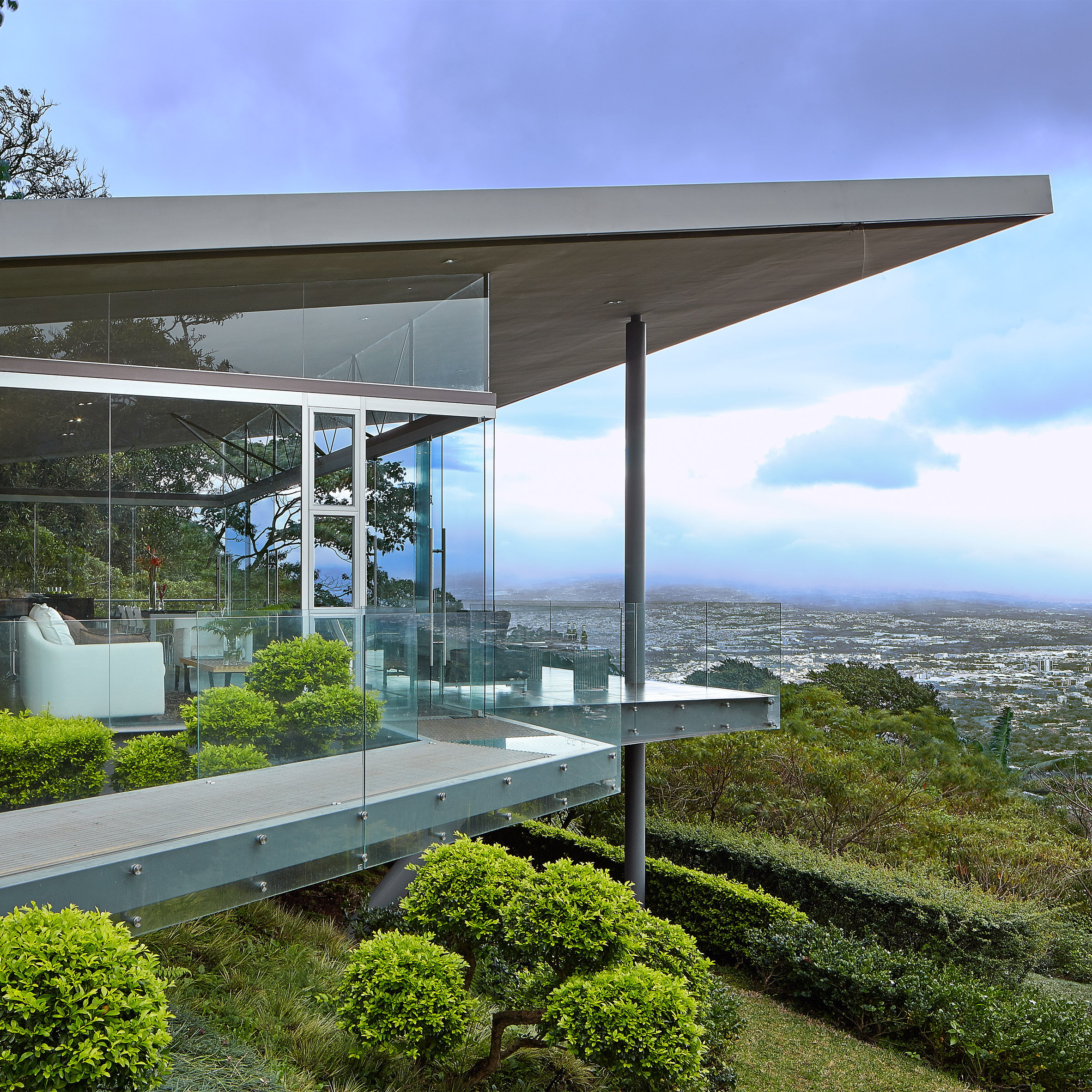 Cañas Arquitectos projects steel and glass Costa Rican home towards views of San Jose-0
