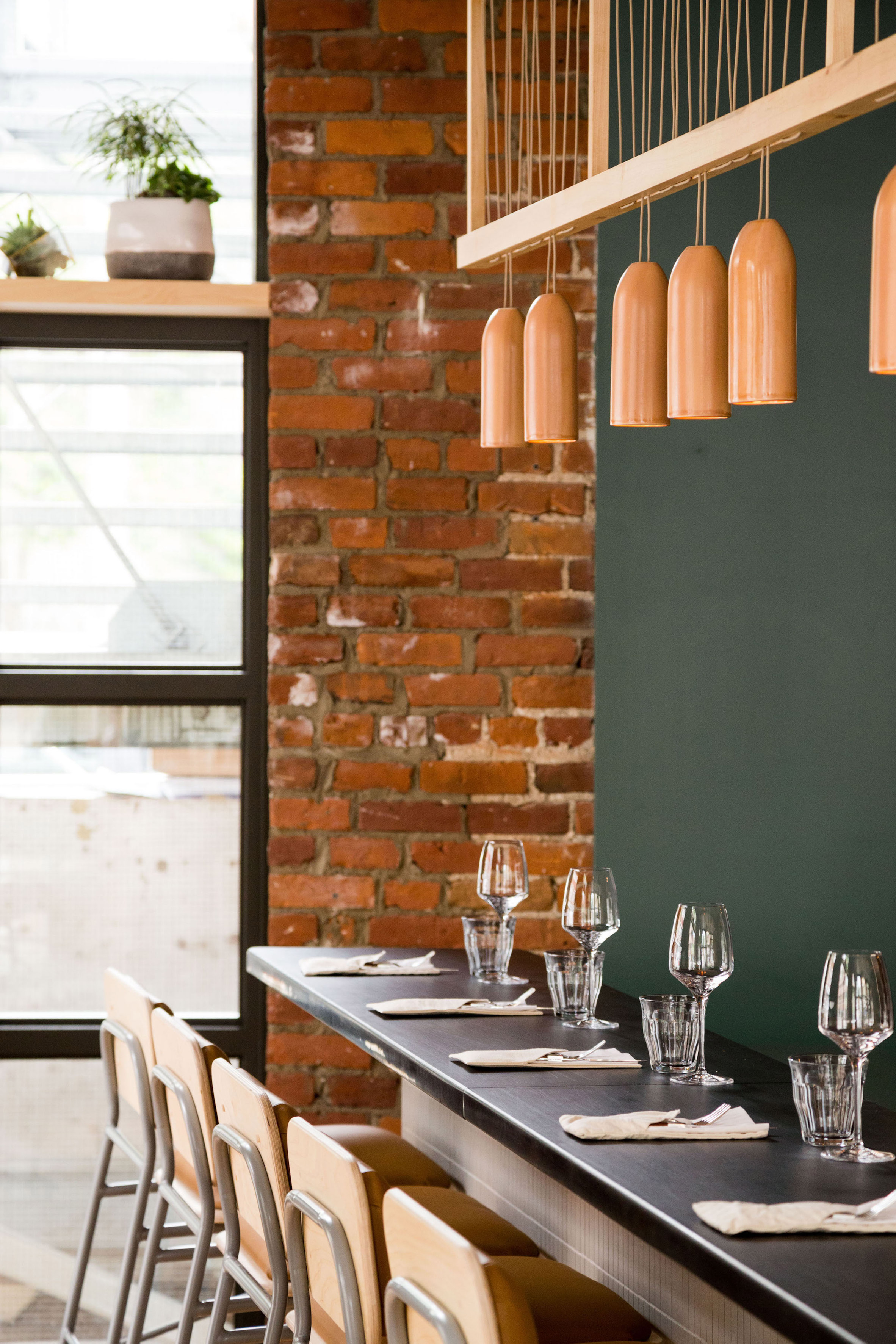 Atelier Filz designs bespoke lighting and chairs for restaurant in Quebec City-12