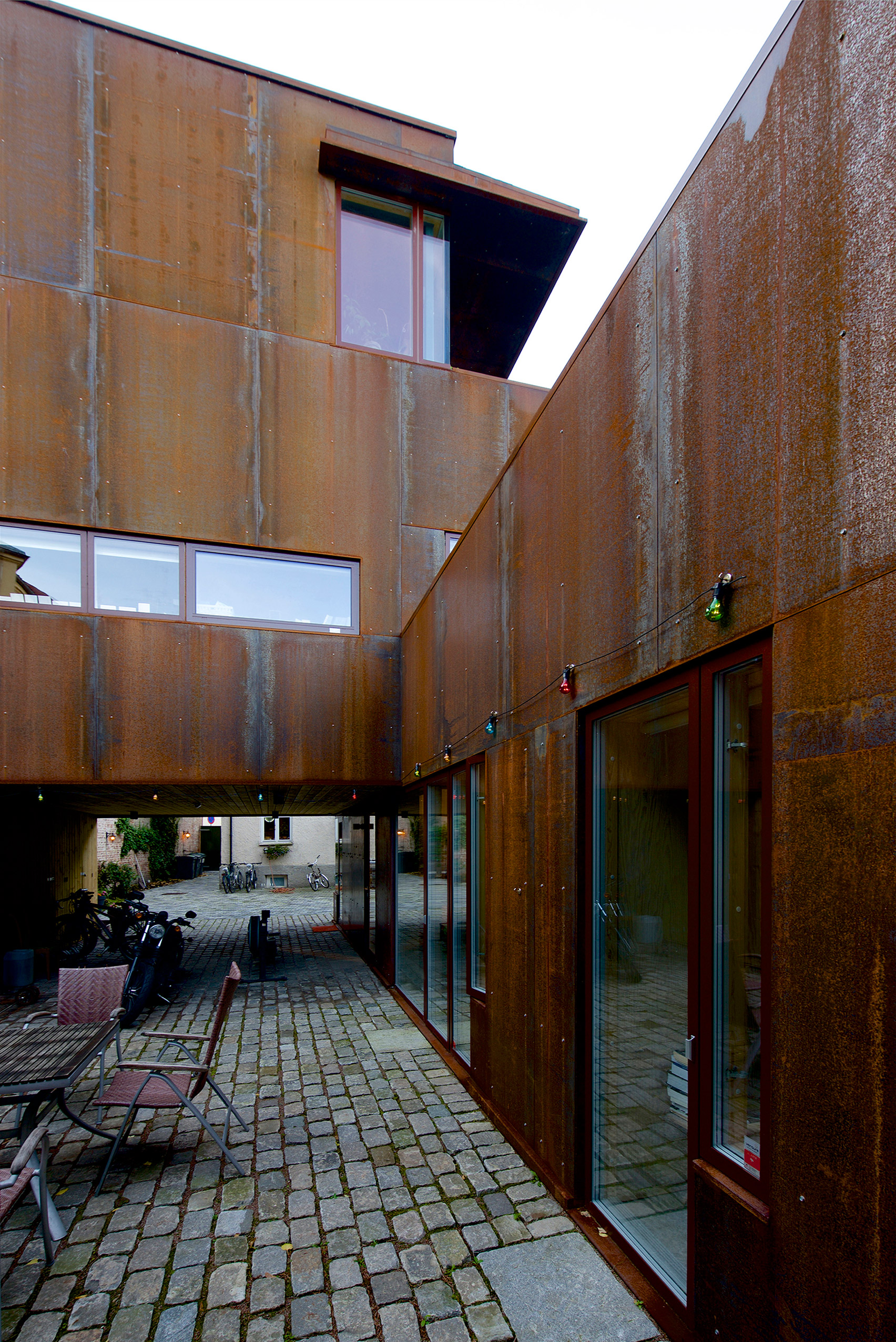Weathering steel panels create rusty walls for house in Oslo's old town-18