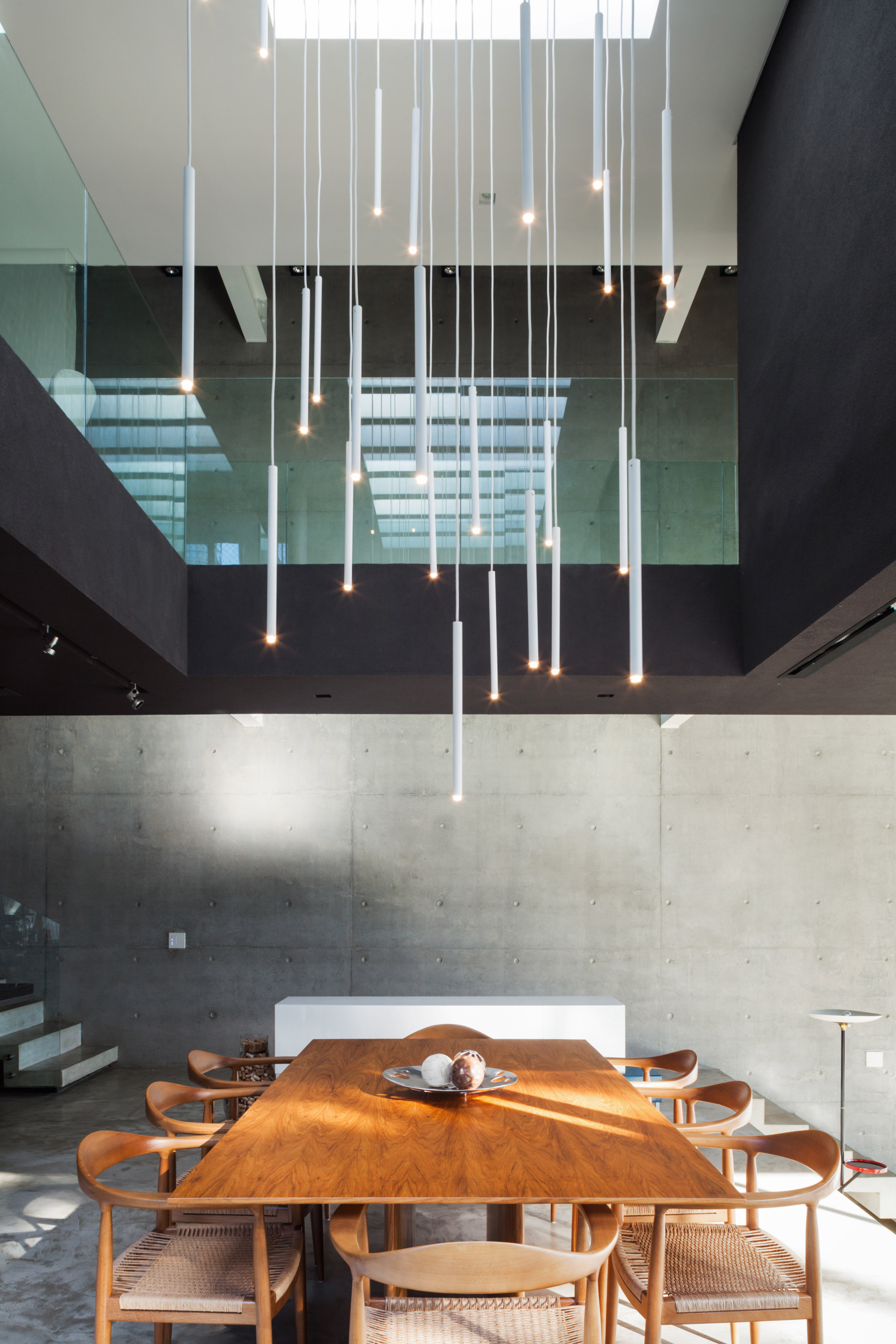 Concrete volume appears to rest on glass in Brazilian house by FGMF Arquitetos-12