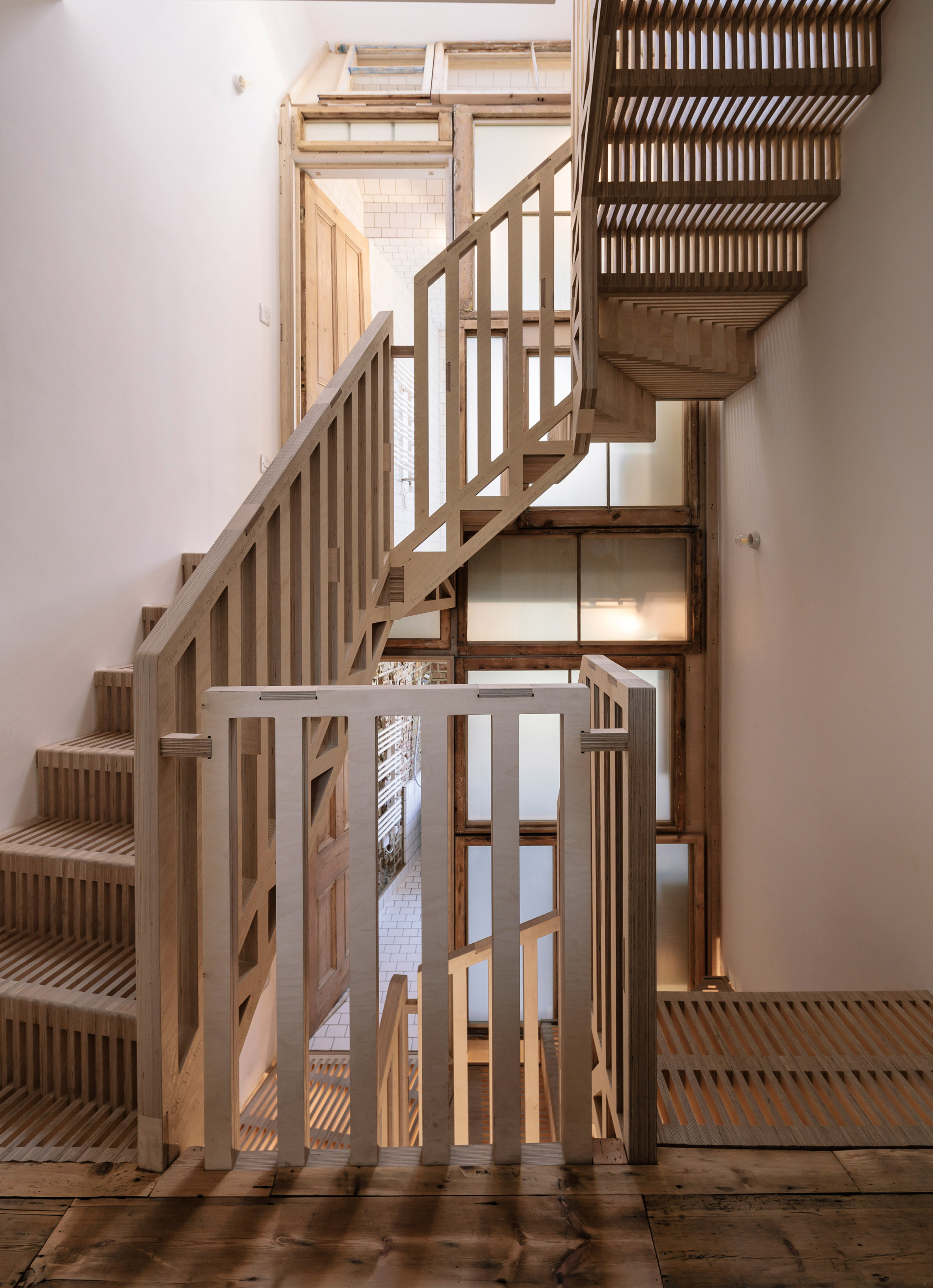 Tsuruta Architects designs staircase in London house from thousands of plywood pieces-5