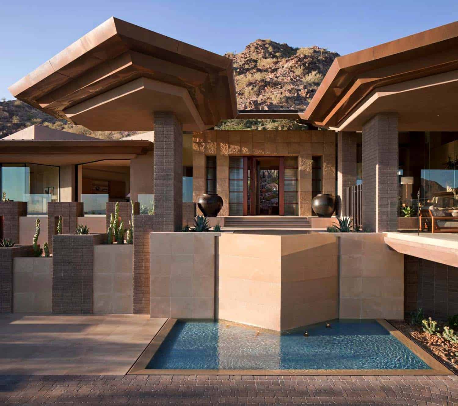 Modern desert home set on a rocky hillside with spectacular city views-29
