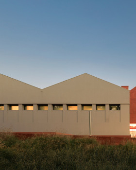 Spaceworkers transforms Portuguese granaries into museum with red-concrete extension