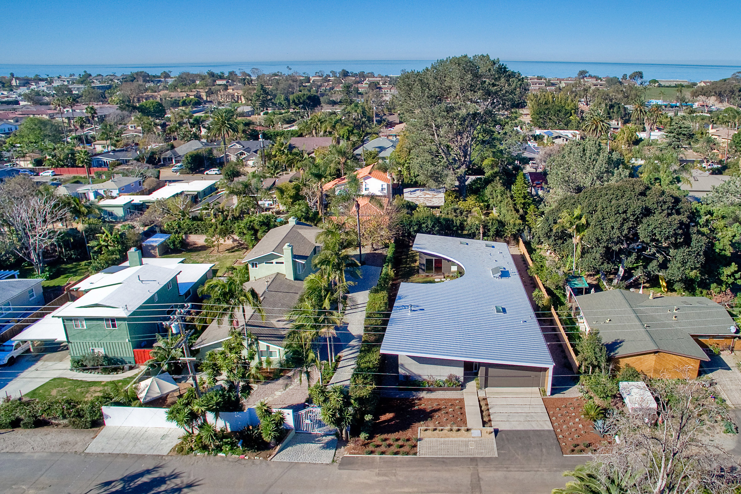 Southern California beach home features angled roof with crescent cutout-2
