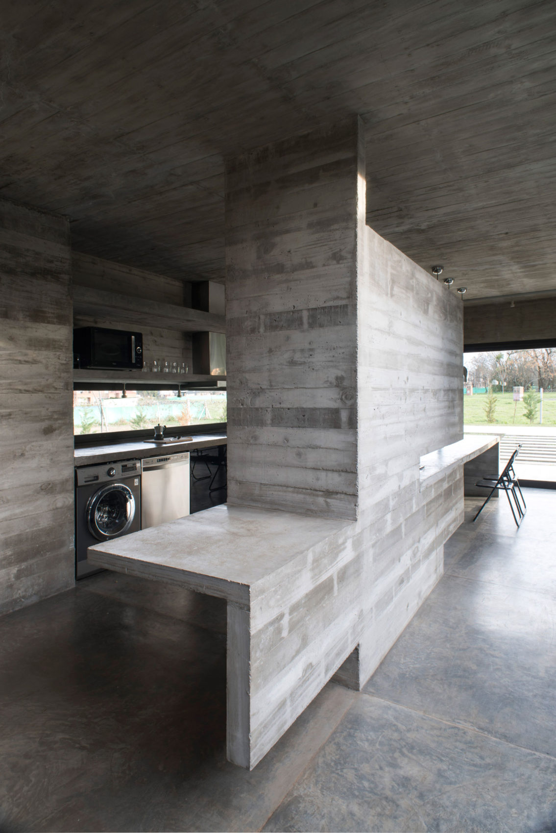 Spectacular Concrete House Surrounded by Fields and Vegetation-26
