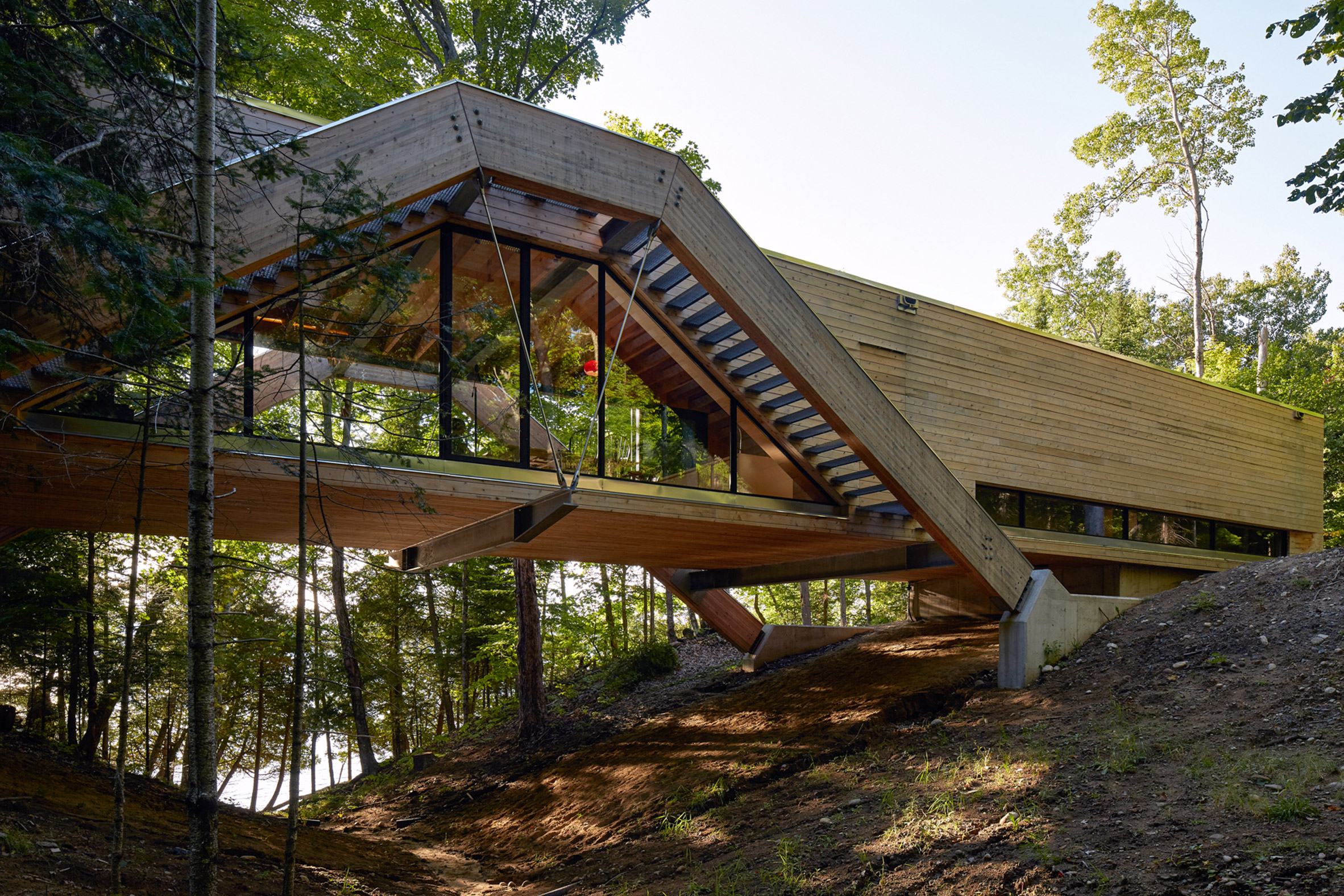 Bridgehouse by Llama Urban Design spans over Canadian forest floor-2