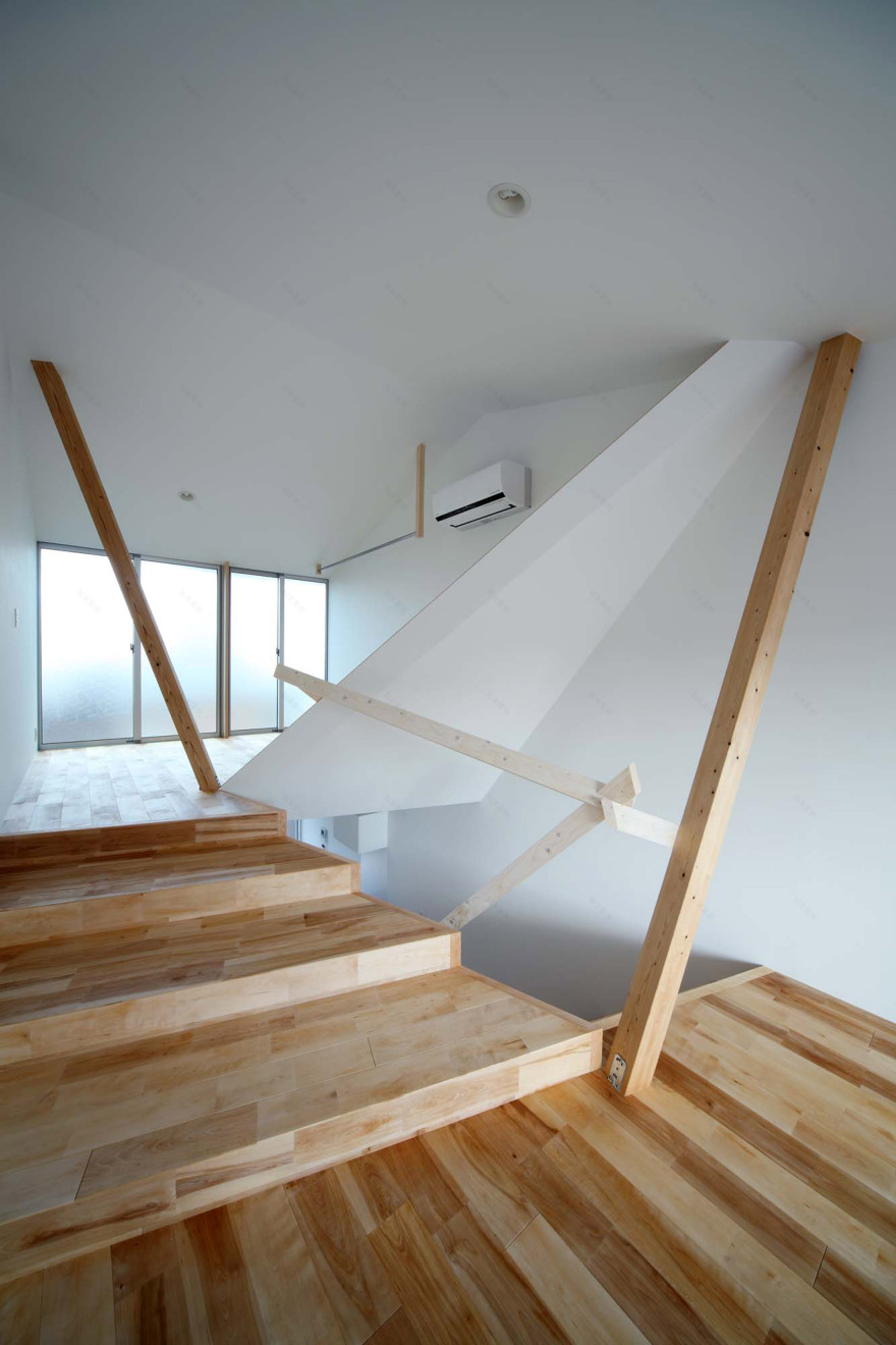 Timber frame projects into rooms and stairwell of compact Kyoto home-12