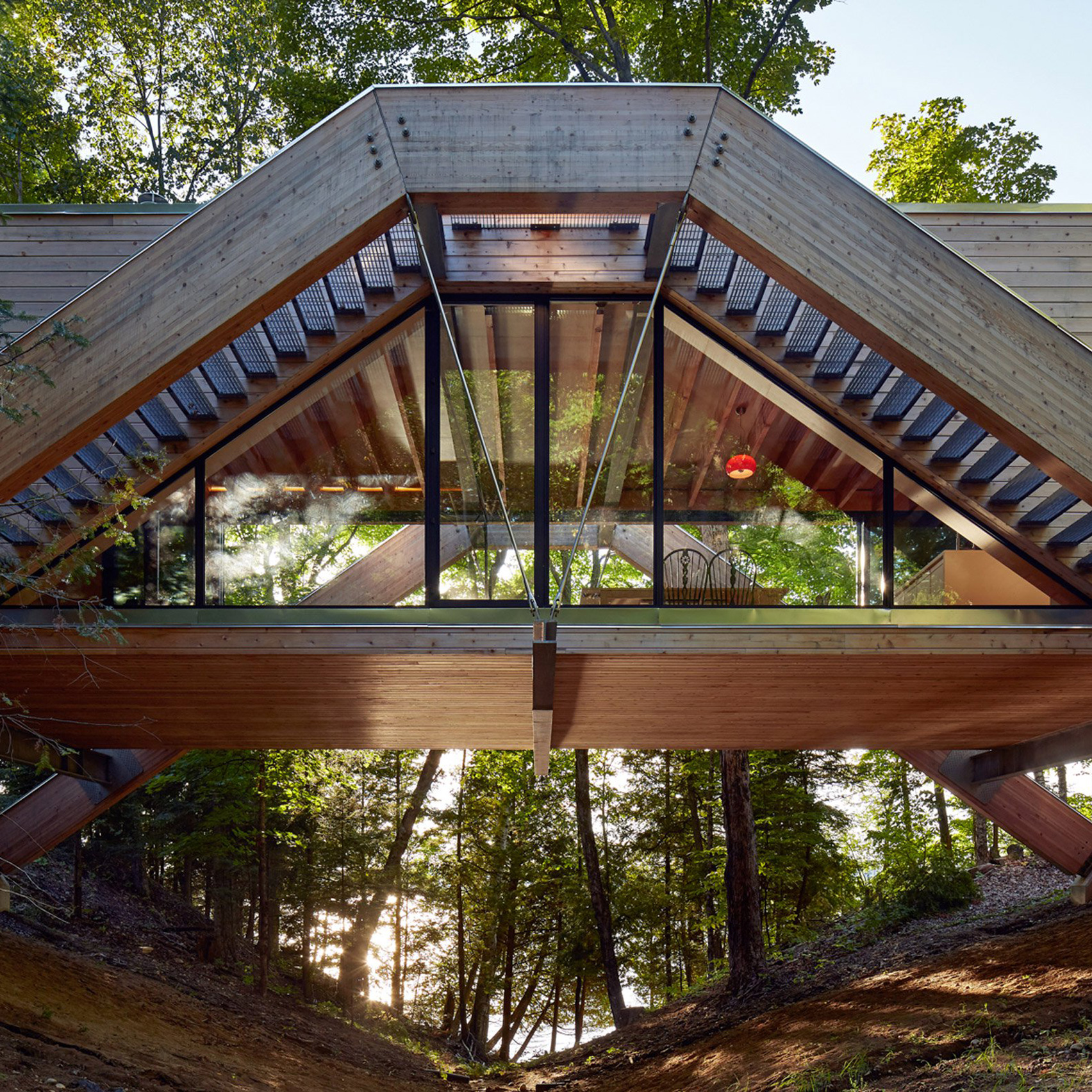 Bridgehouse by Llama Urban Design spans over Canadian forest floor-0