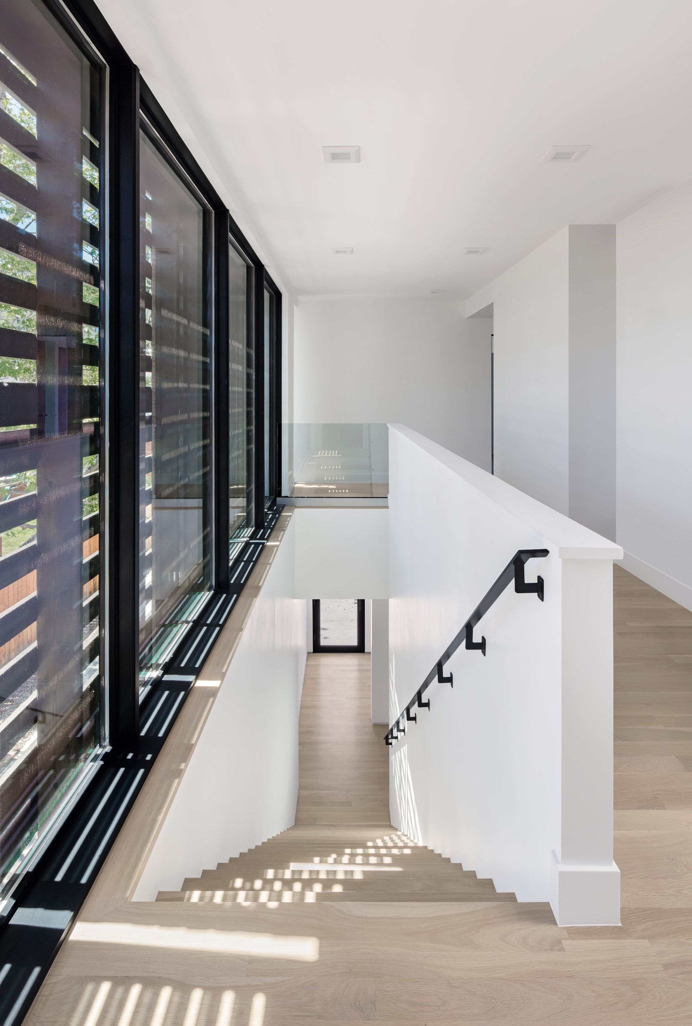 Meridian 105's Denver house features screens and shutters made of black wooden pallets-21