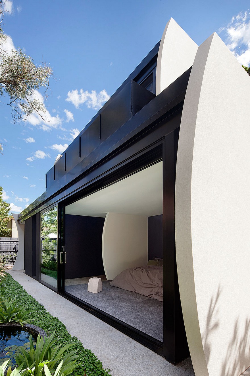 Unconventional House With Elliptical-Shaped Walls That Create New Spatial Perspectives-36