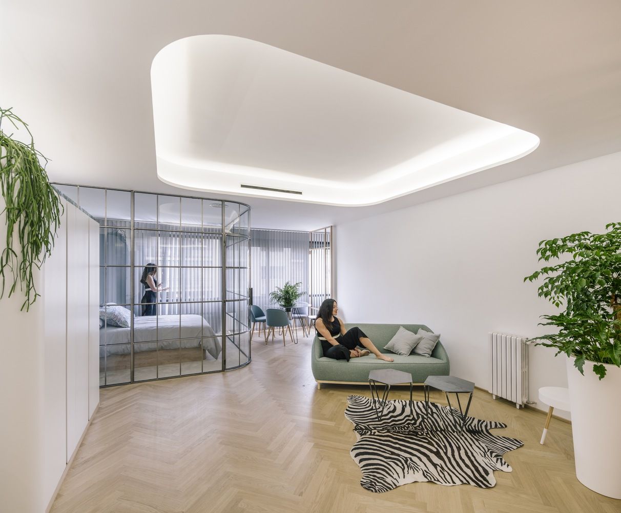 Glass Walls and Lots of Curves Distinguish Luxury Madrid Apartment Renovation-15
