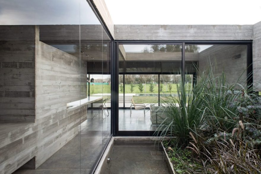 Spectacular Concrete House Surrounded by Fields and Vegetation-22