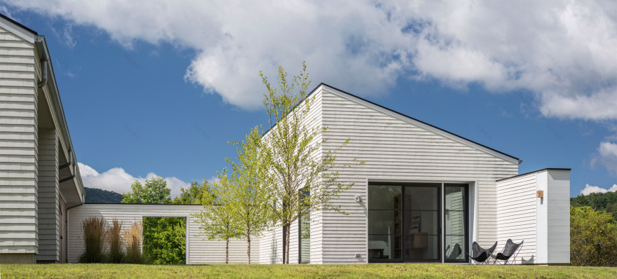 Two white volumes frame central courtyard of Vermont home by Birdseye Design-6