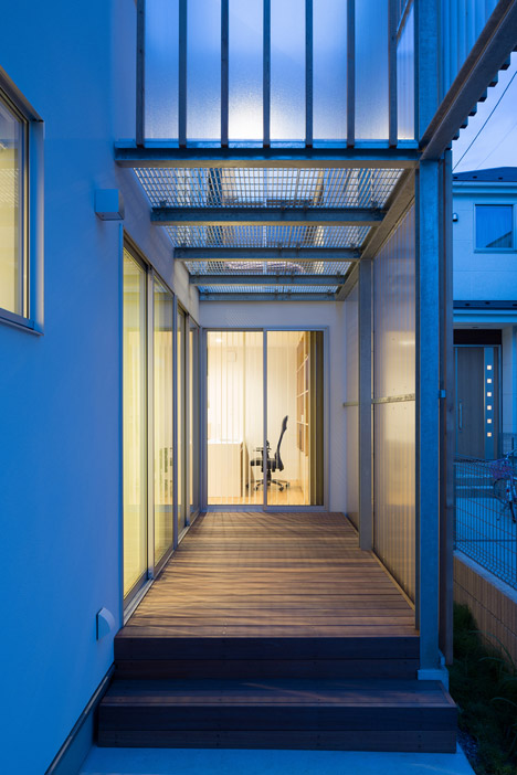 House K by Yuji Kimura Design conceals terraces behind a tall wall-34