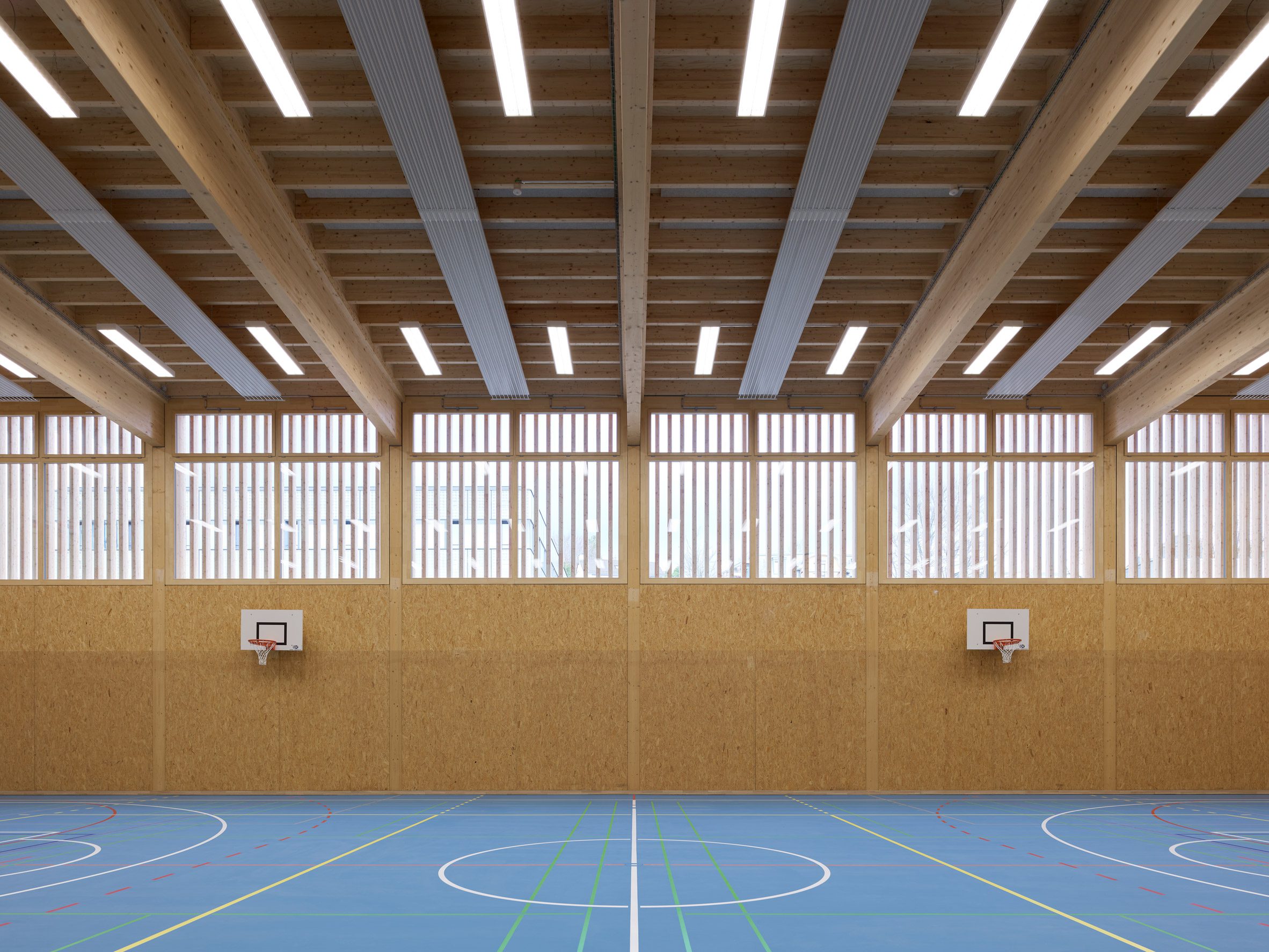 Itten+Brechbühl creates demountable timber sports hall for University of Zurich-21