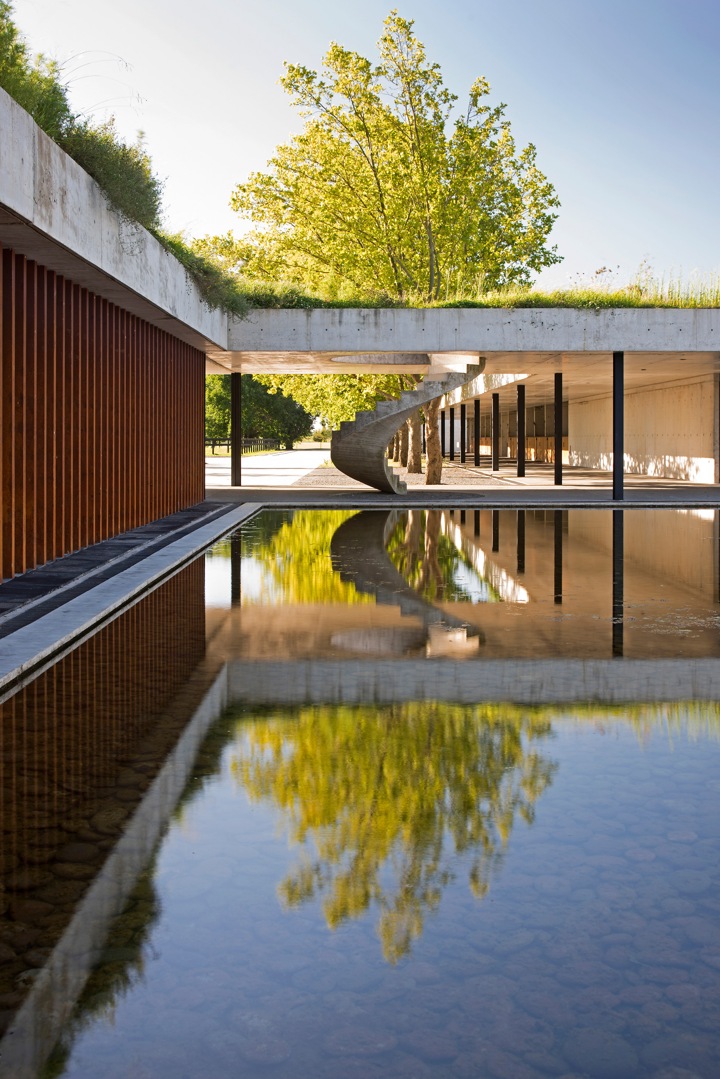 Polo stables features grassy roof for horses to graze and spectators to sit-24