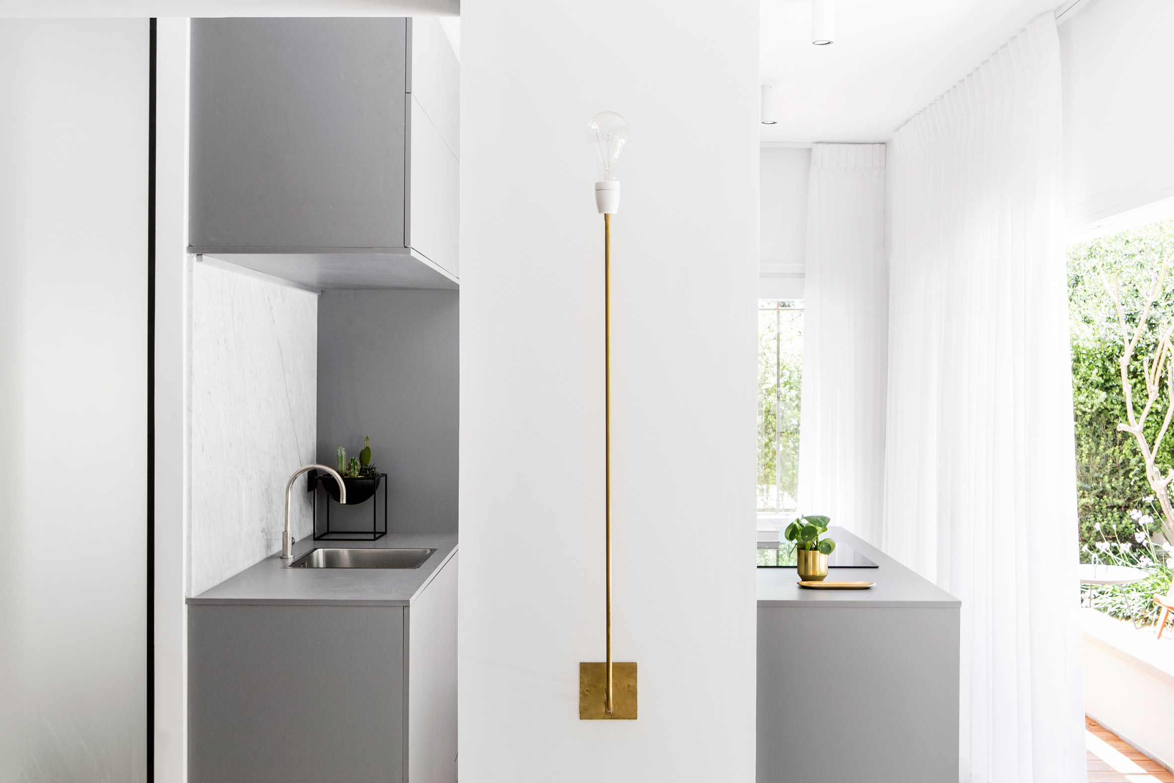 Amir Navon and Maayan Zusman employ space-saving tricks for tight Tel Aviv apartment-12