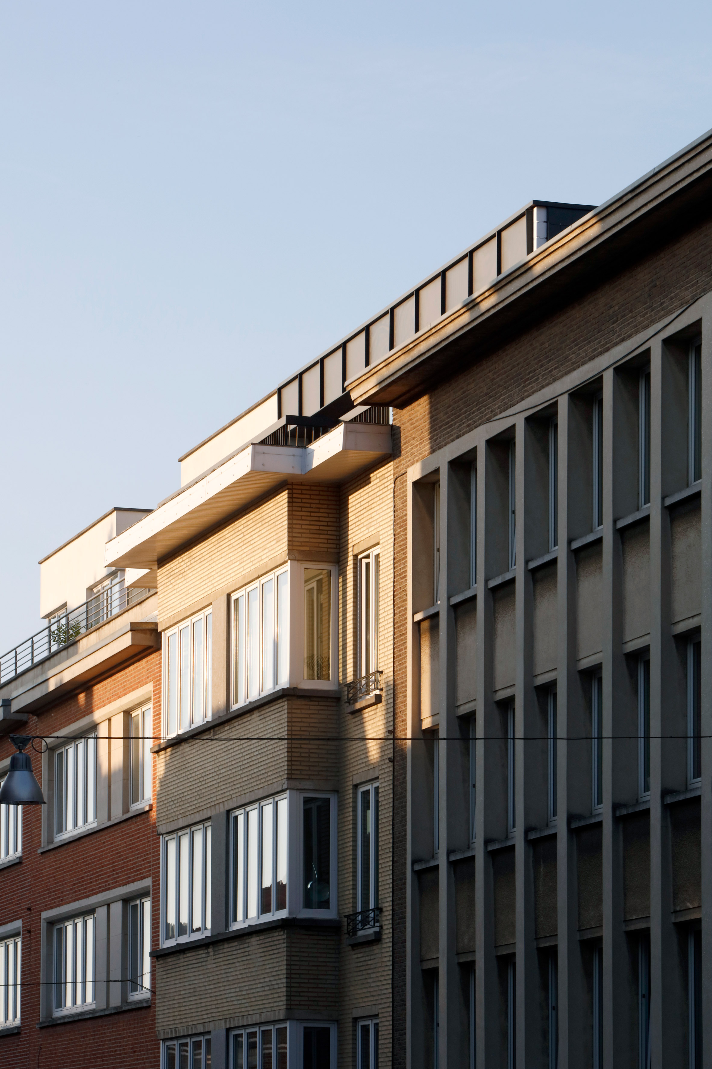 Alvar Aalto inspired the orange fireplace in this Brussels roof extension-29