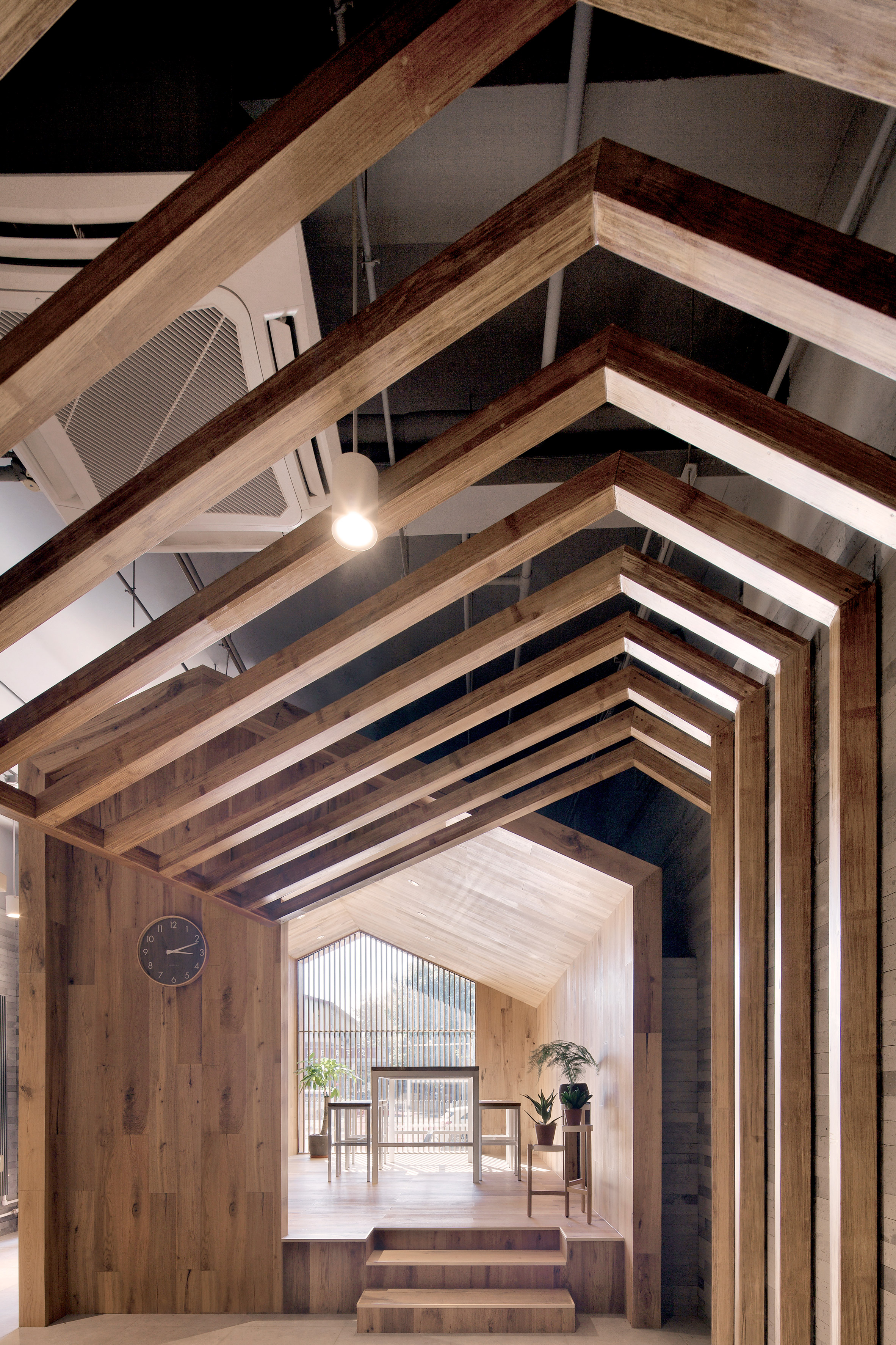 Penda inserts house-shaped opening into facade of hotel in Beijing hutong-6