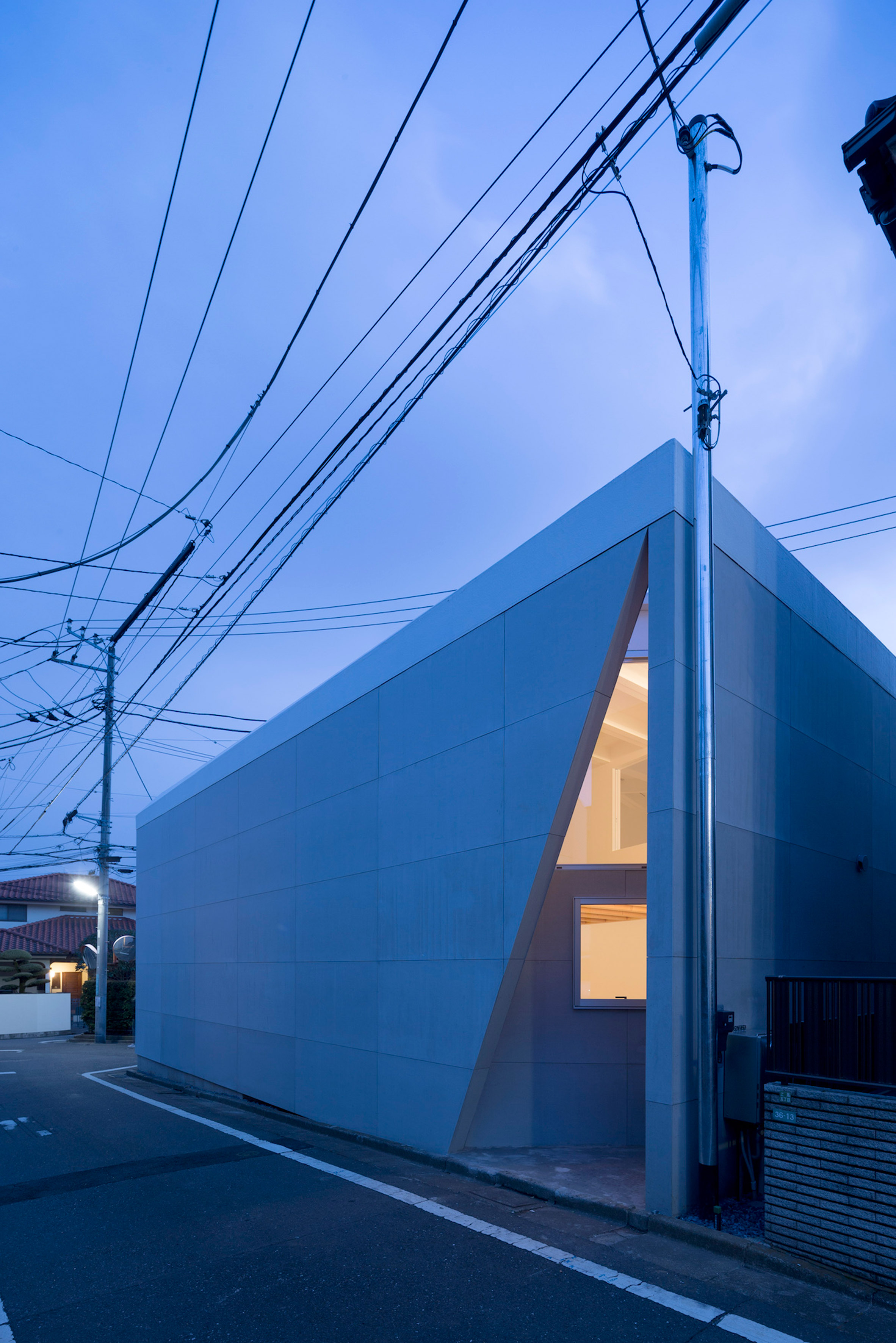 Chop + Archi cuts lightwells into corners of triangular house in Tokyo-12