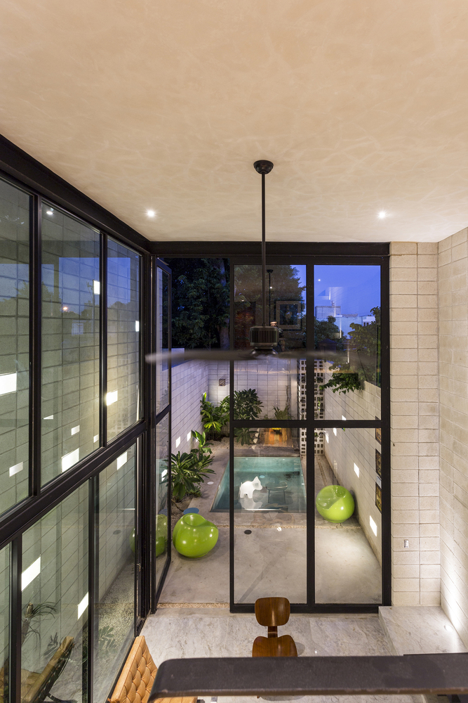 Narrow House Sandwiched Between Two Buildings And A Pool-5