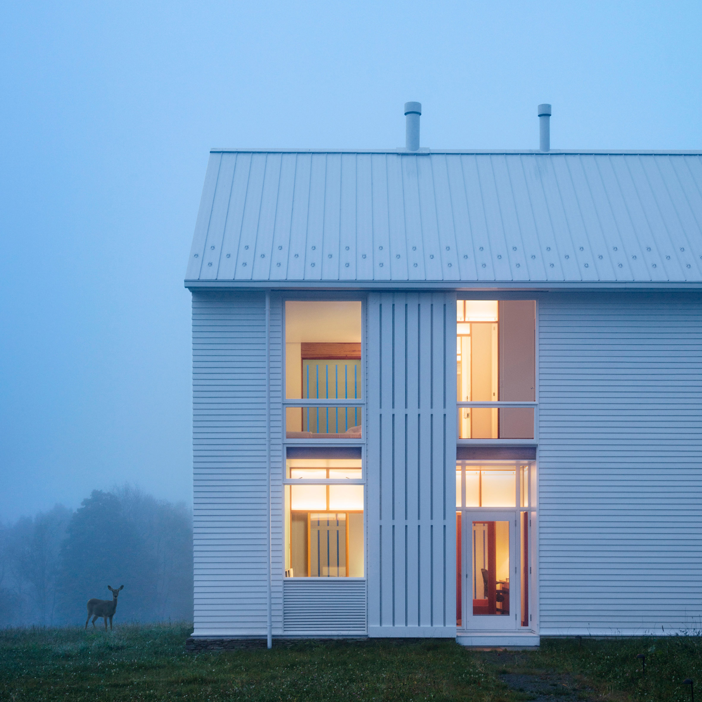 Huge rolling shutters shade Pennsylvania farmhouse by Cutler Anderson-0