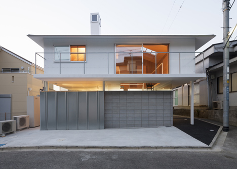 House in Kawanishi by Tato Architects with hipped roof and stilts-41