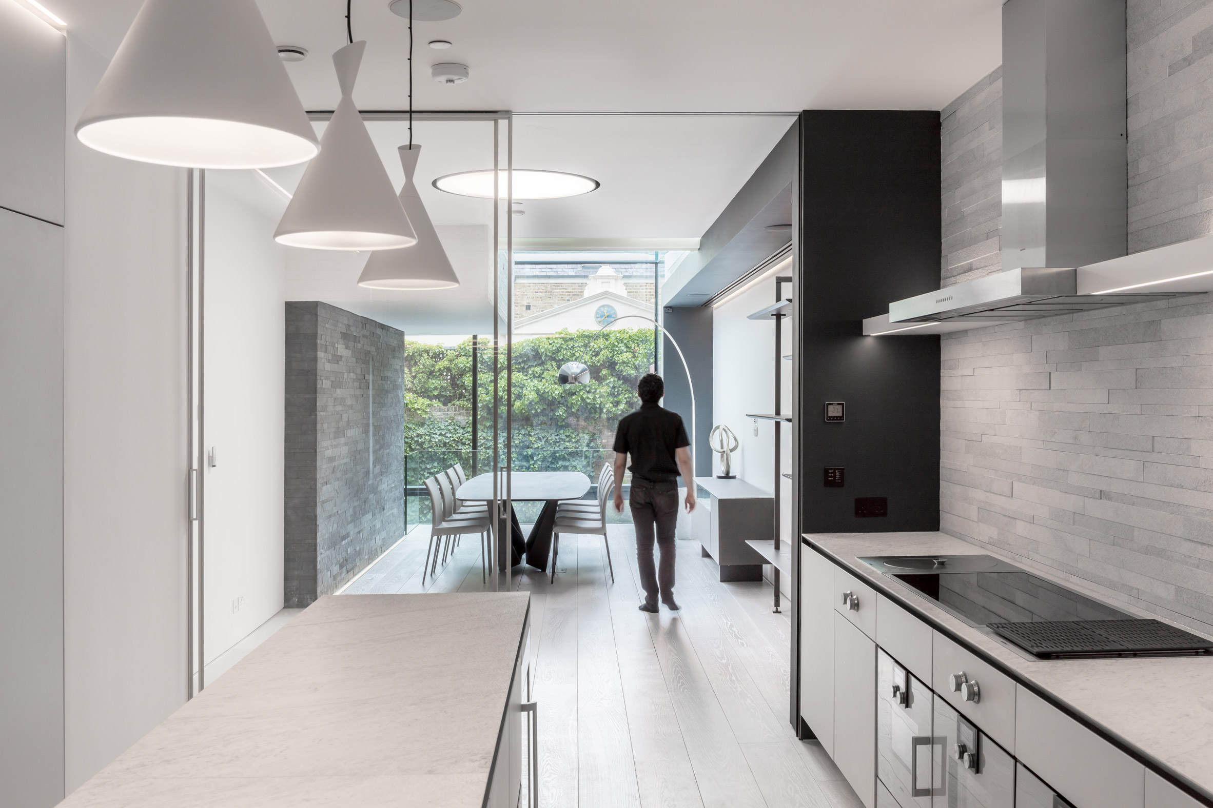 Glass box defines extension with basement pool to Victorian home in south London-13