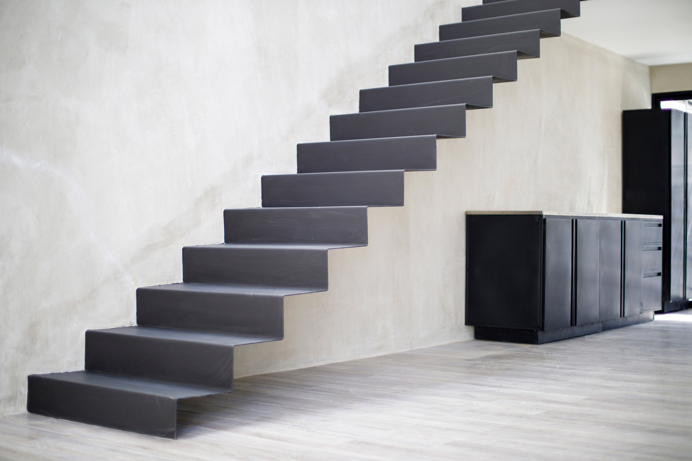 Outdoor terrace divides two sides of zinc and concrete home in Costa Rica-14