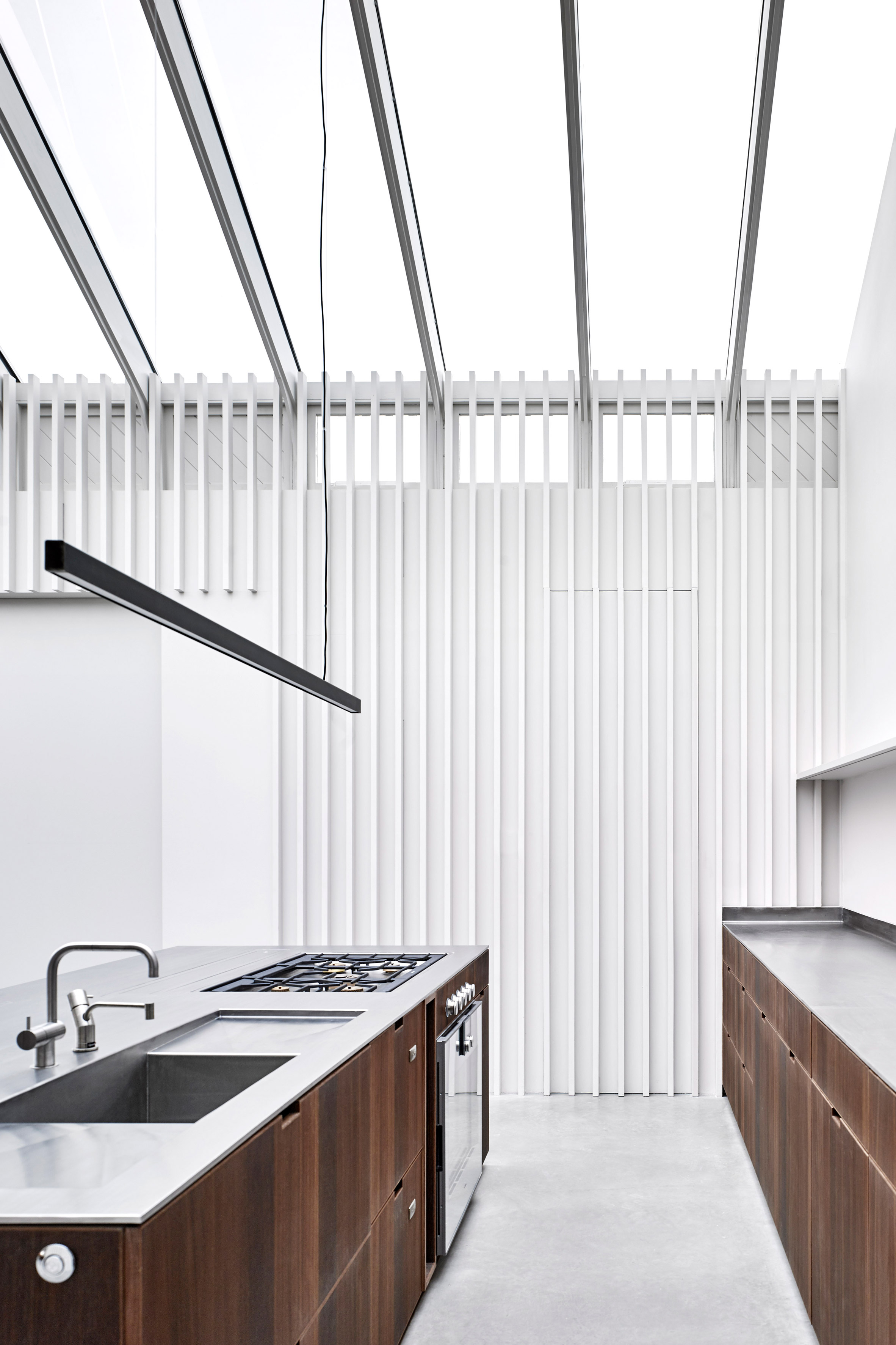 McLaren Excell contrasts smoked oak with white panelling in renovated London offices-5
