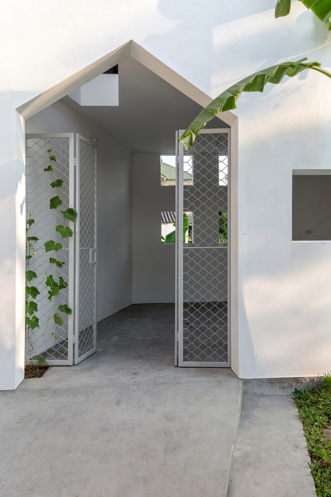 越南中部狭长土地上的共生小屋-24