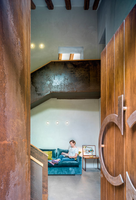 Weathered steel and stone combine in Zest Architecture's restored farmhouse-10